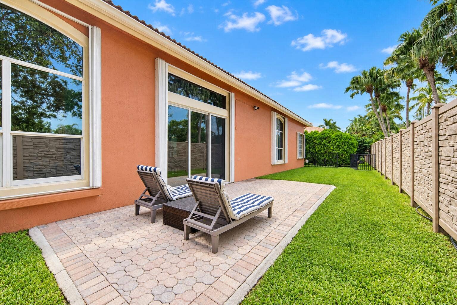 11950 NW 3RD Drive, Coral Springs, FL 33071 Sunny Terracotta Patio with Striped Chai
