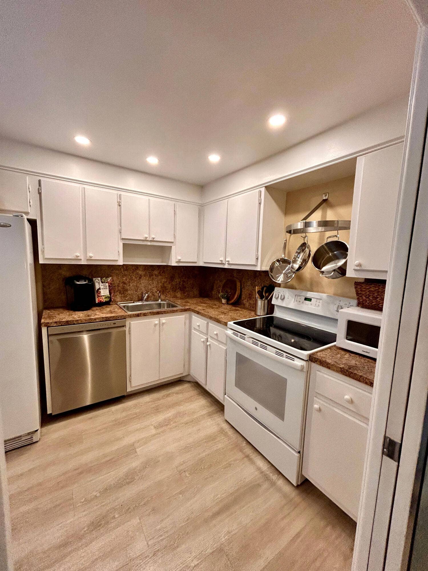 All cooking utensils you need to prepare your meals and Keurig coffee maker plus a new countertop microwave
