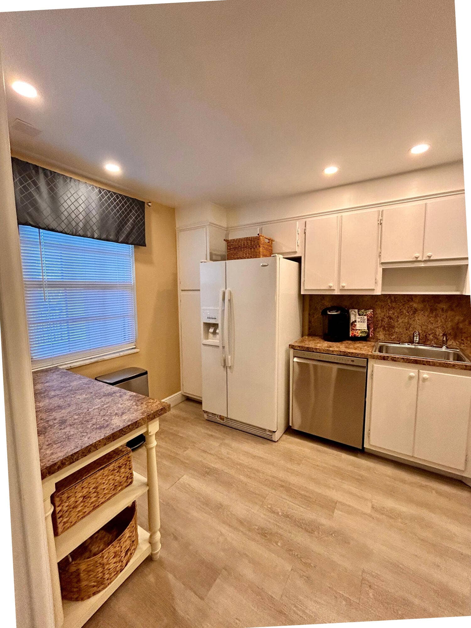 Although there is an ice maker and water in the door, the landlord has disabled and there are ice trays and water bottles inside the refrigerator