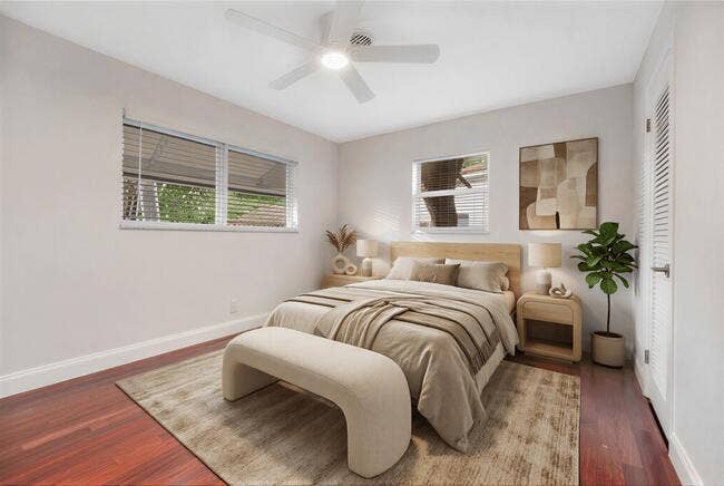 2142 NE 17th Avenue, Wilton Manors, FL 33305 Virtually staged. Wood-finish flooring, white walls, and a ceiling fan with integrated lighting