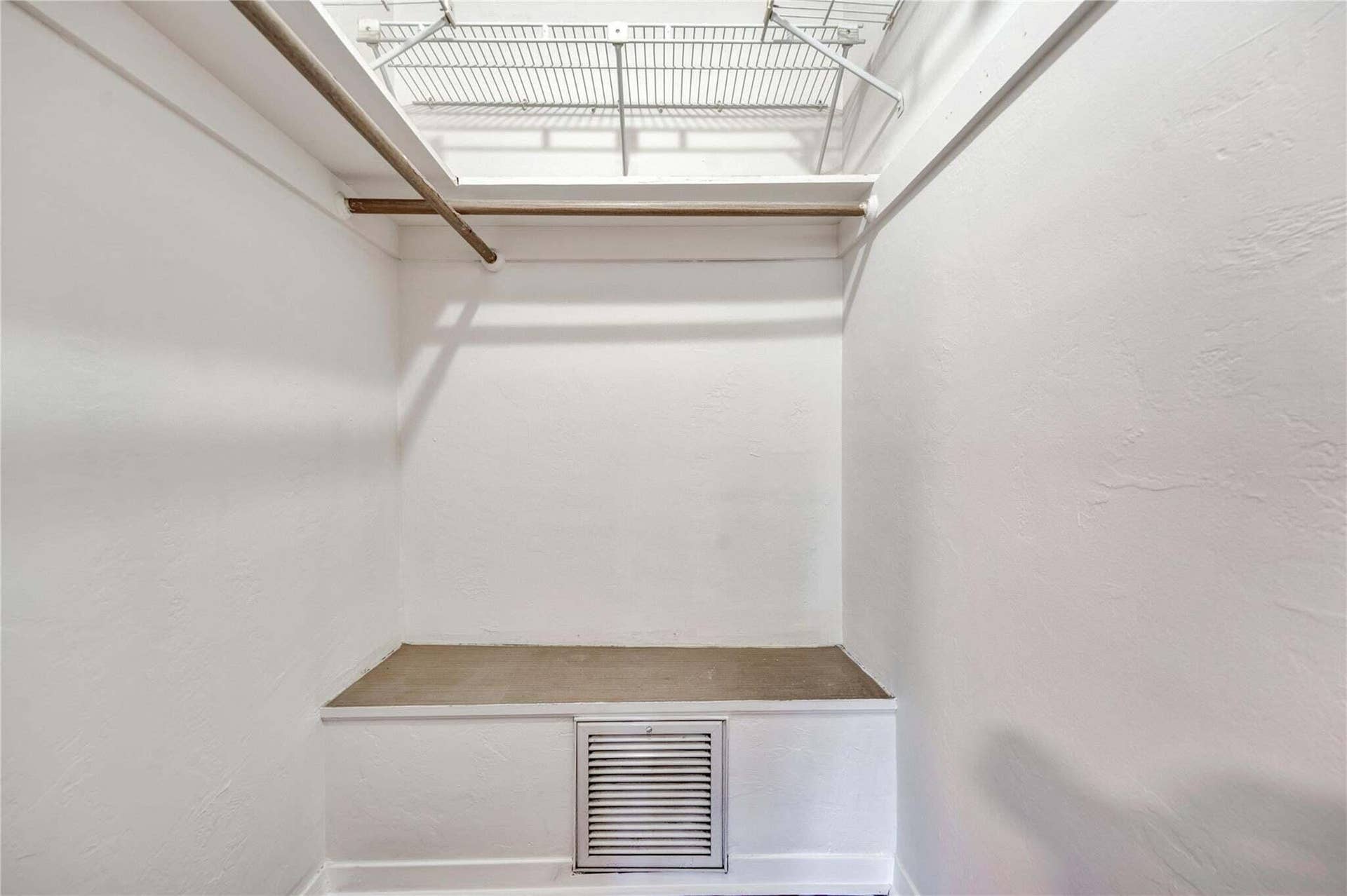 2142 NE 17th Avenue, Wilton Manors, FL 33305 Built-in shelving, hanging rod, and additional storage platform