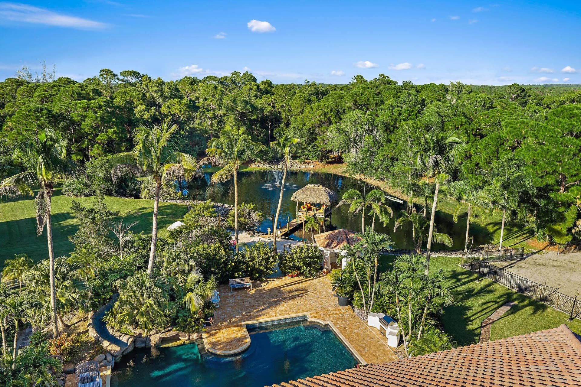 2584 SE Ranch Acres Circle, Jupiter, FL 33478 Estate Pool and Lake Setting
