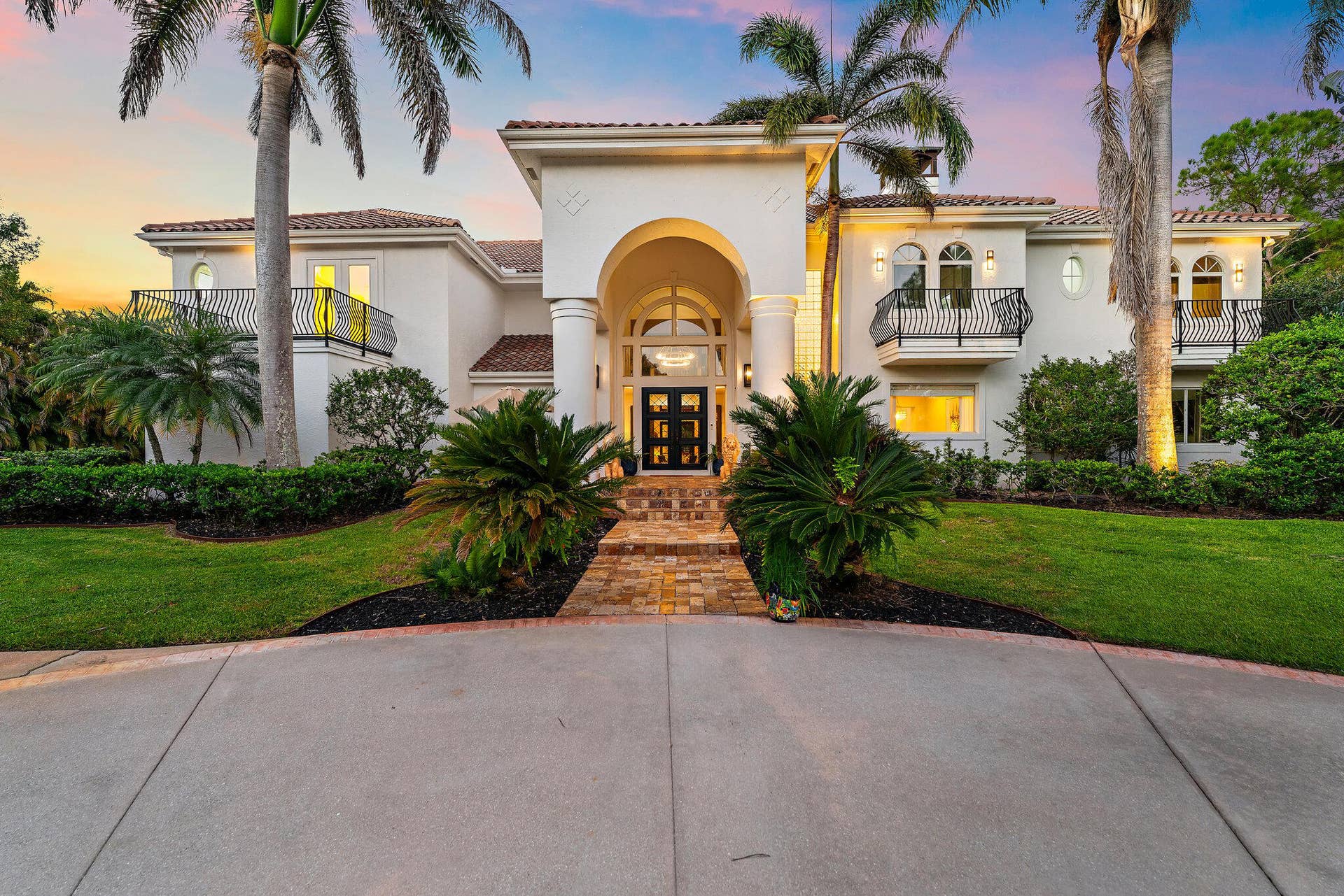 2584 SE Ranch Acres Circle, Jupiter, FL 33478 Formal Entry at Twilight