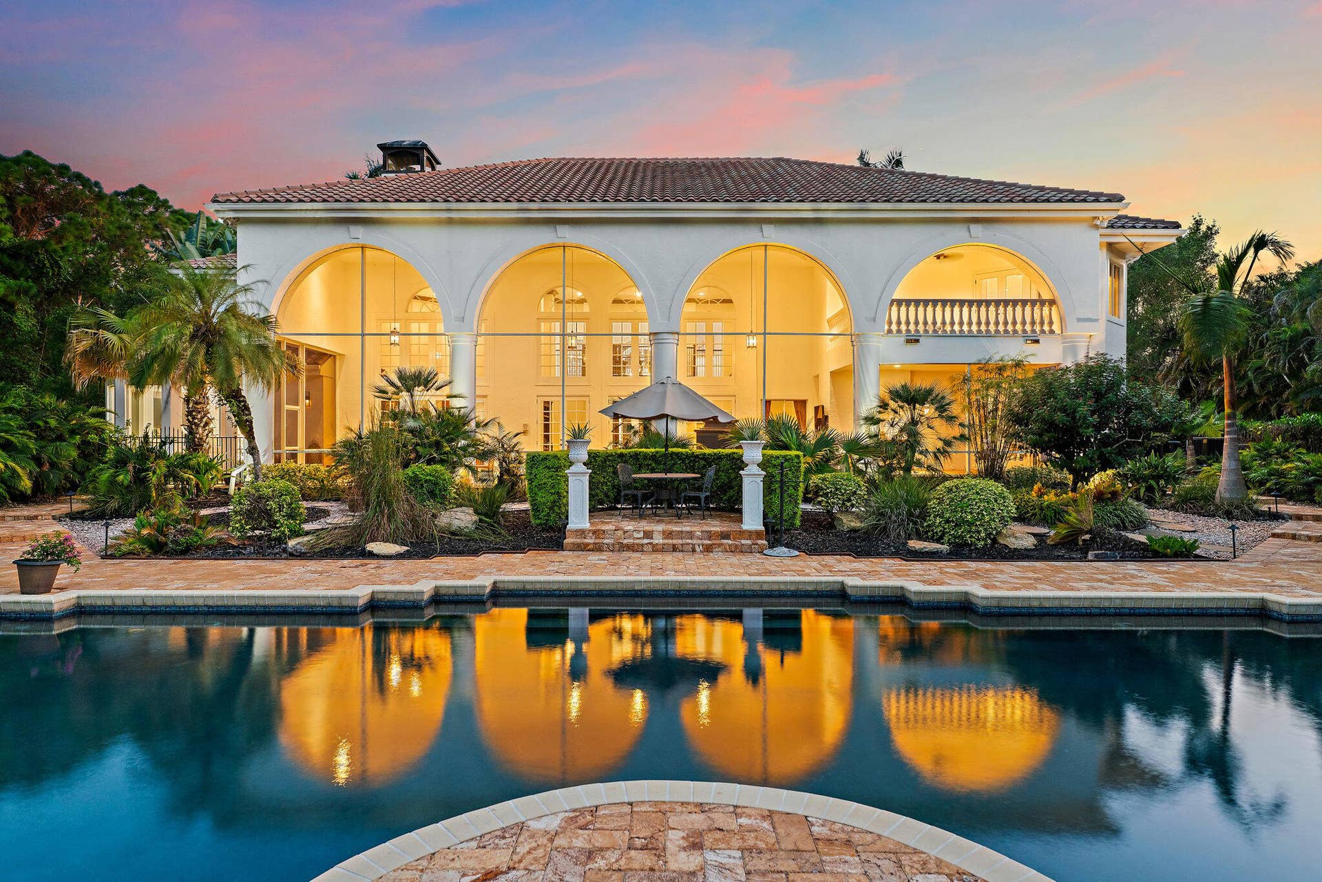2584 SE Ranch Acres Circle, Jupiter, FL 33478 Rear Estate View at Twilight