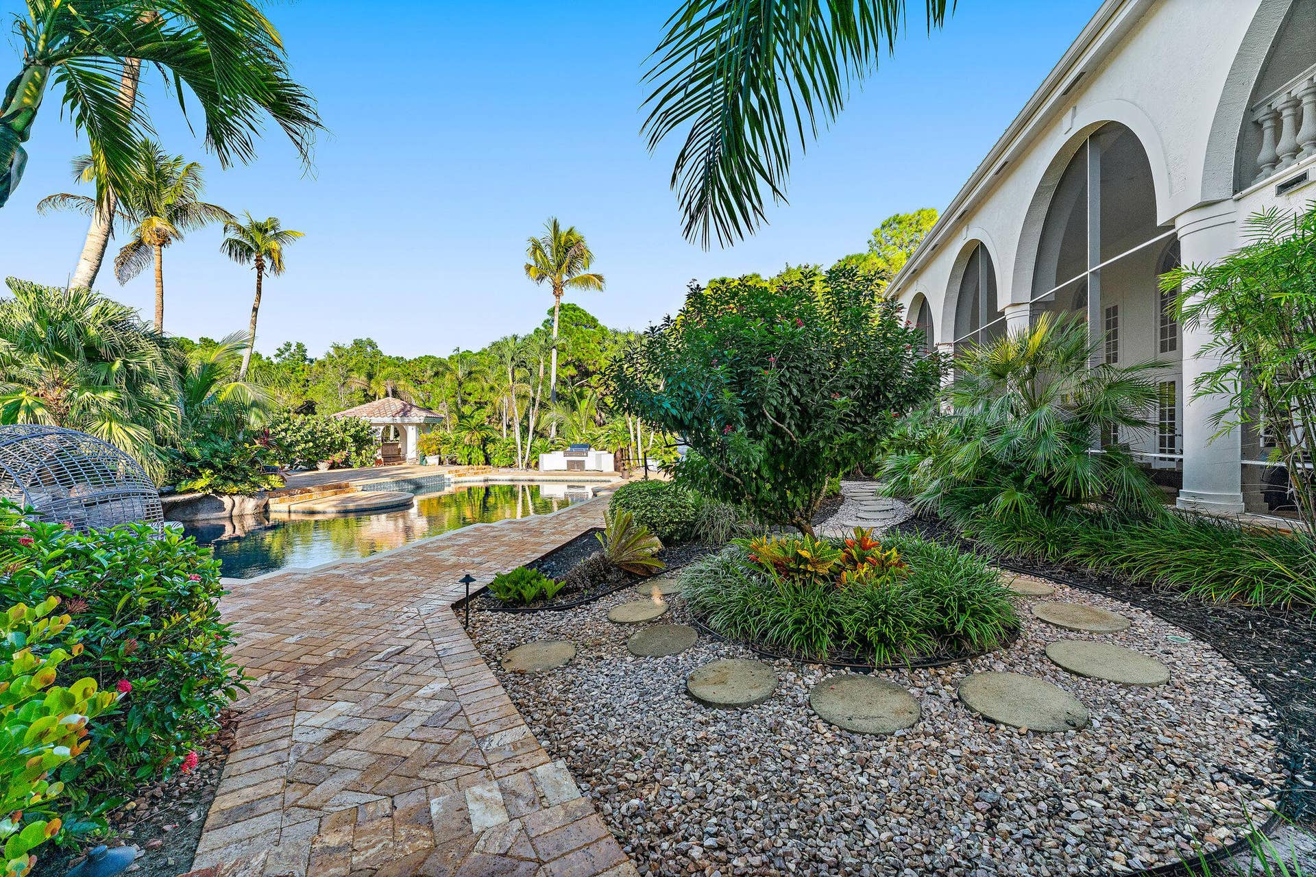 2584 SE Ranch Acres Circle, Jupiter, FL 33478 Garden Pathway to the Pool