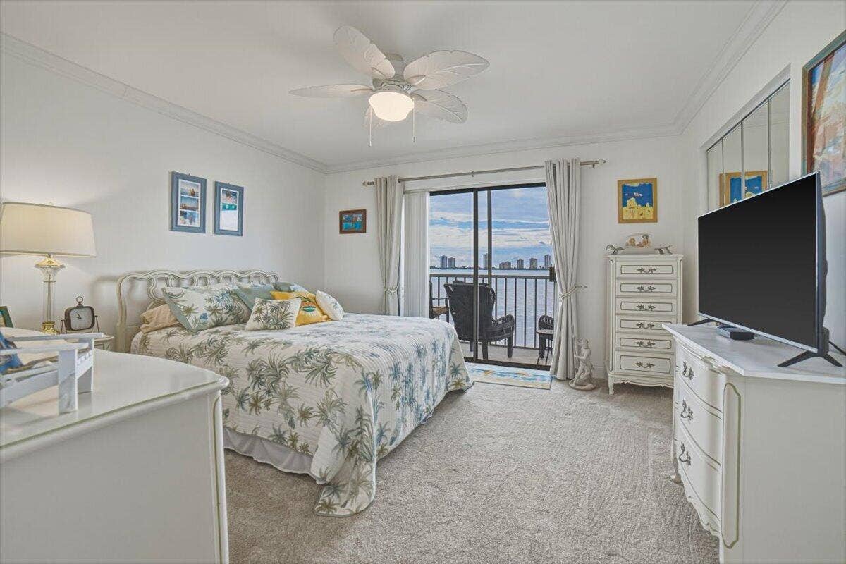 101 Doolen Court, #205, North Palm Beach, FL 33408 Bedroom with sliders out to balcony