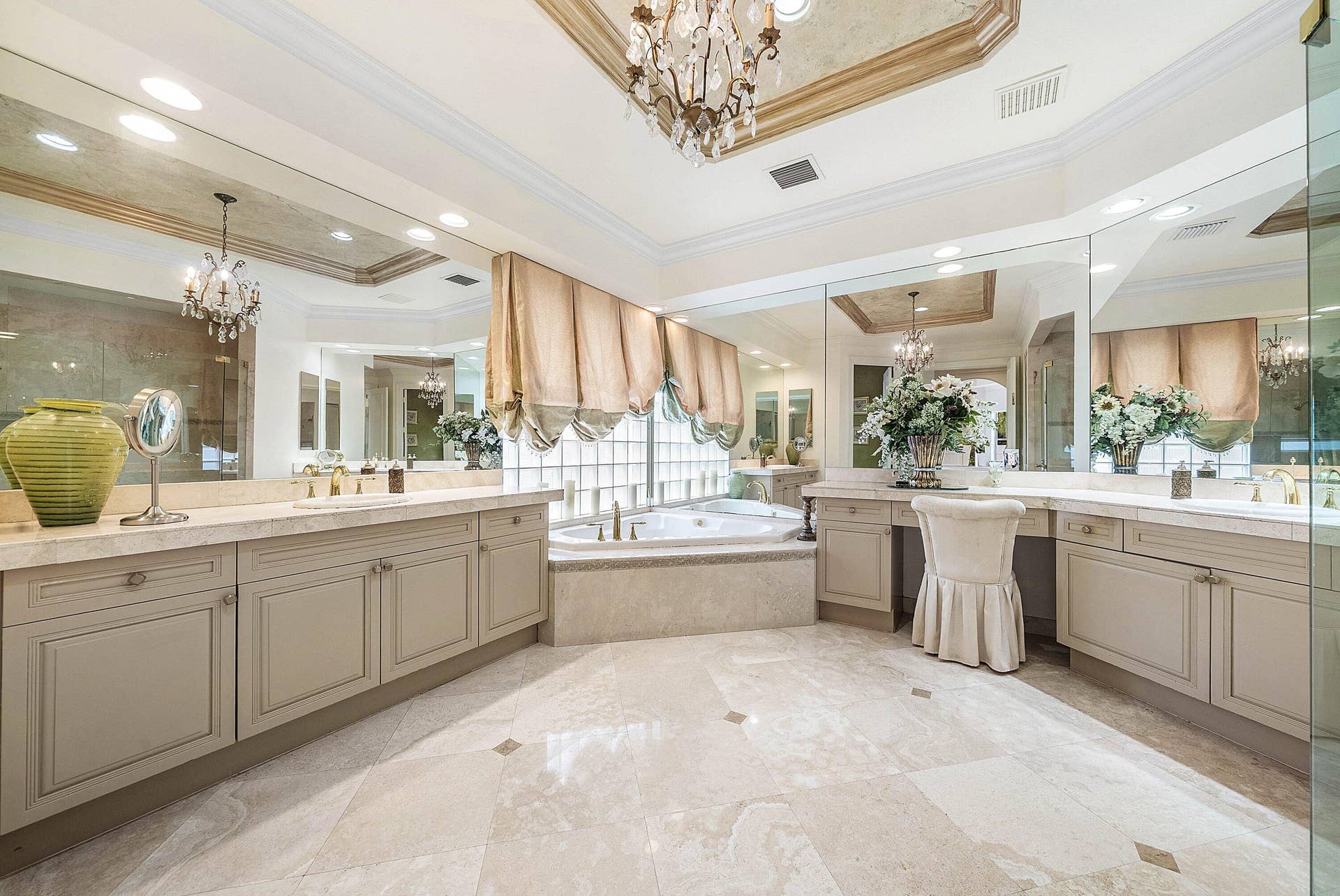 Extensive vanity with dual sinks, built-in makeup area, and integrated storage