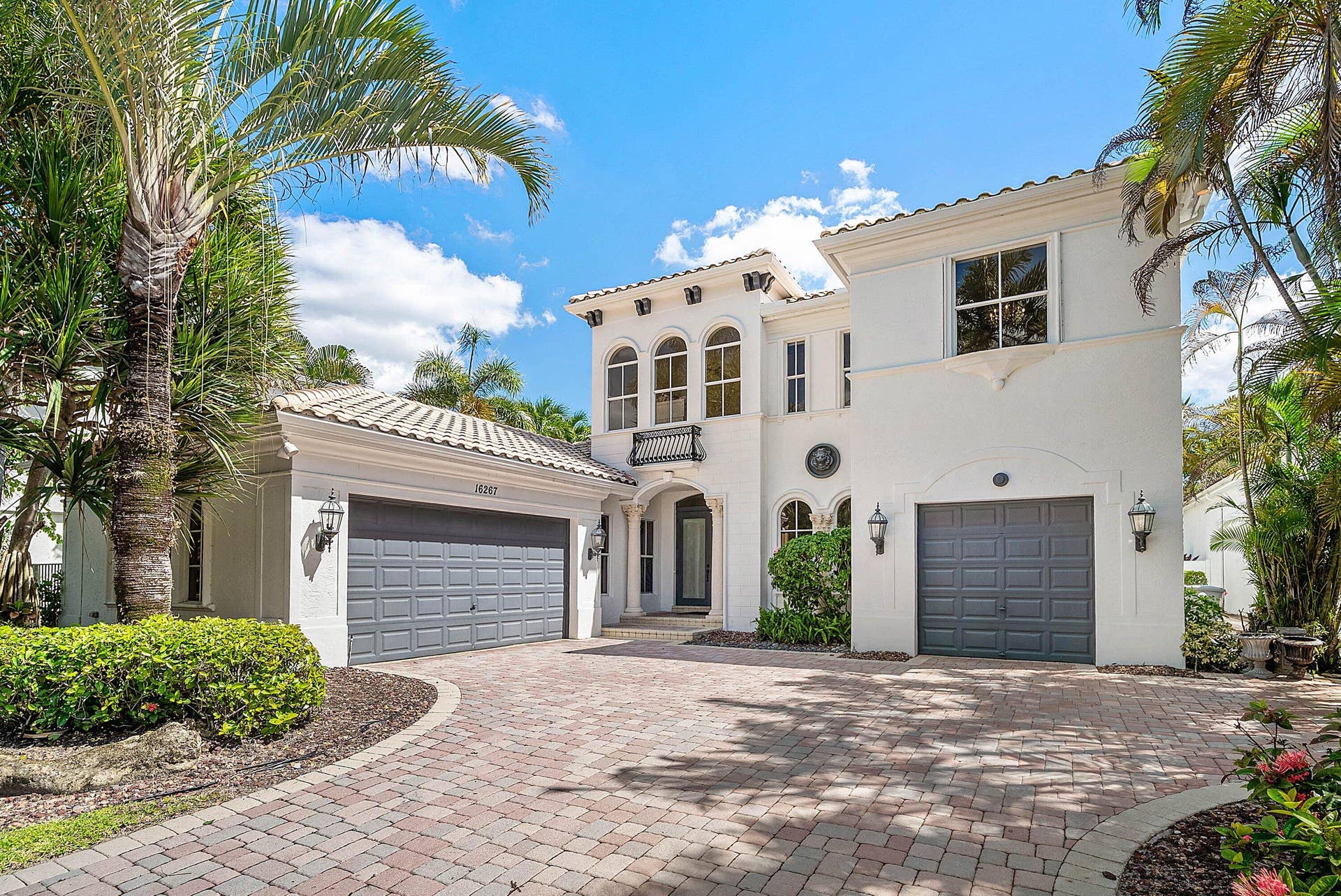 Decorative Paver Driveway with ample parking space + A Double Bay & Single Bay garage