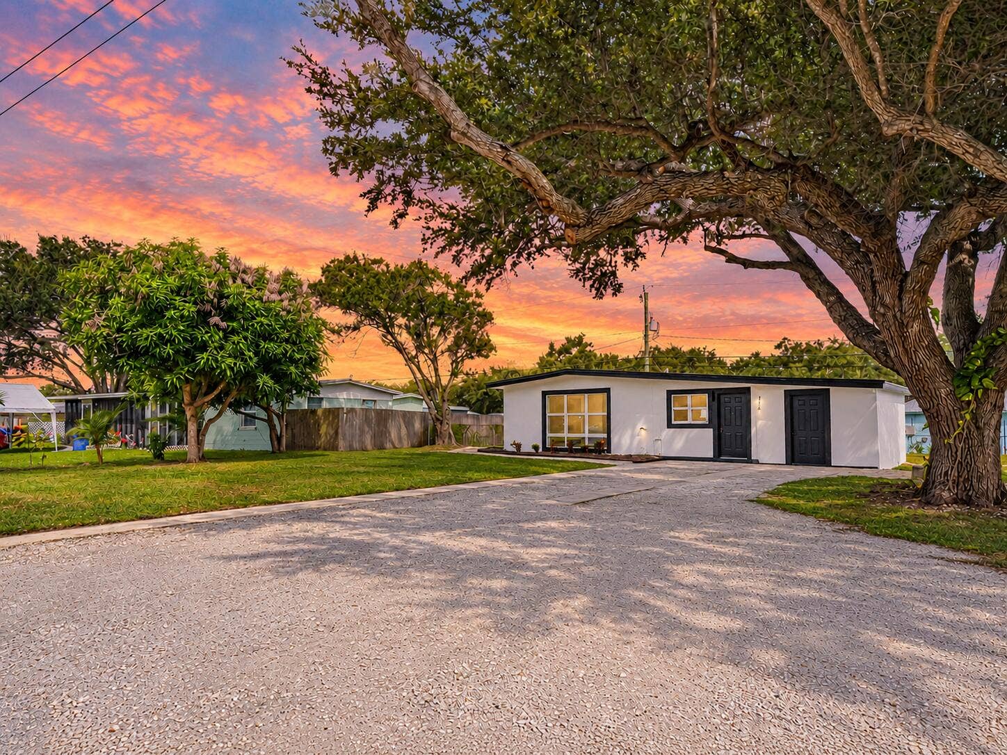 Ranch House Beneath a Vibrant Sunset