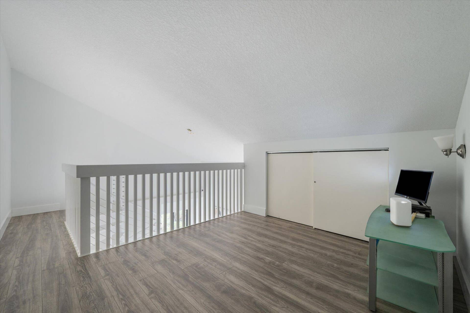2890 ANTIETAM Lane, West Palm Beach, FL 33409 Wood-finish flooring with a white railing