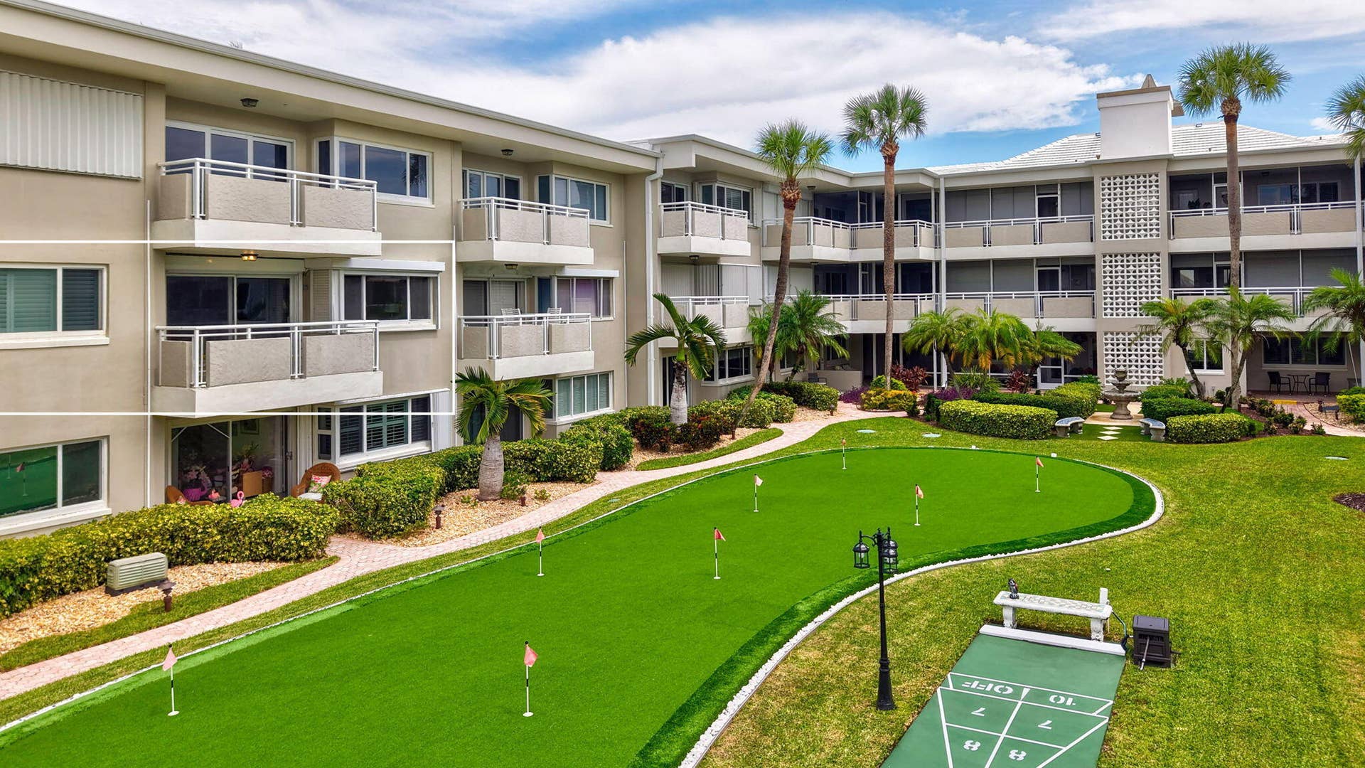 1198 Hillsboro Mile, #210, Hillsboro Beach, FL 33062 Manicured putting green, shuffleboard court, multiple balconies, mature palm trees, and a central courtyard water feature