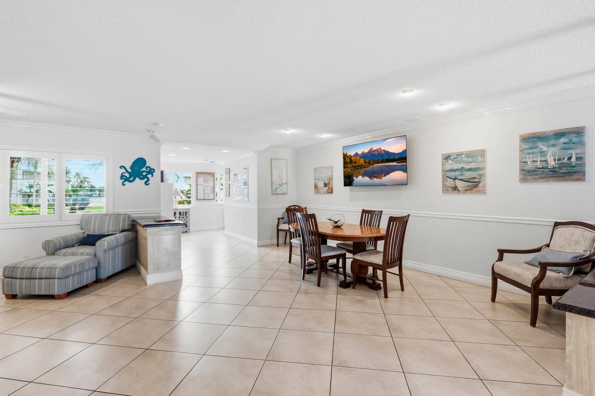 1198 Hillsboro Mile, #210, Hillsboro Beach, FL 33062 Recessed lighting illuminates the space, featuring large square floor tiles and multiple windows