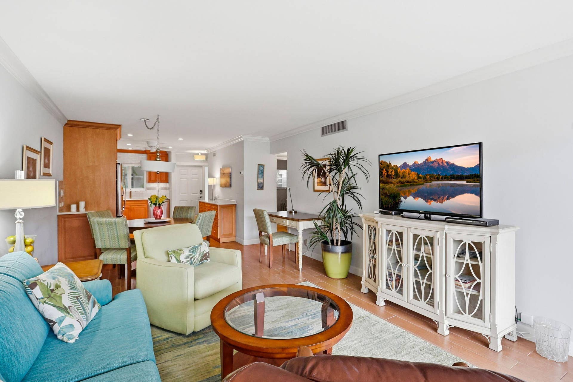 1198 Hillsboro Mile, #210, Hillsboro Beach, FL 33062 Open-concept living space with light-toned walls, crown molding, and wood-finish flooring