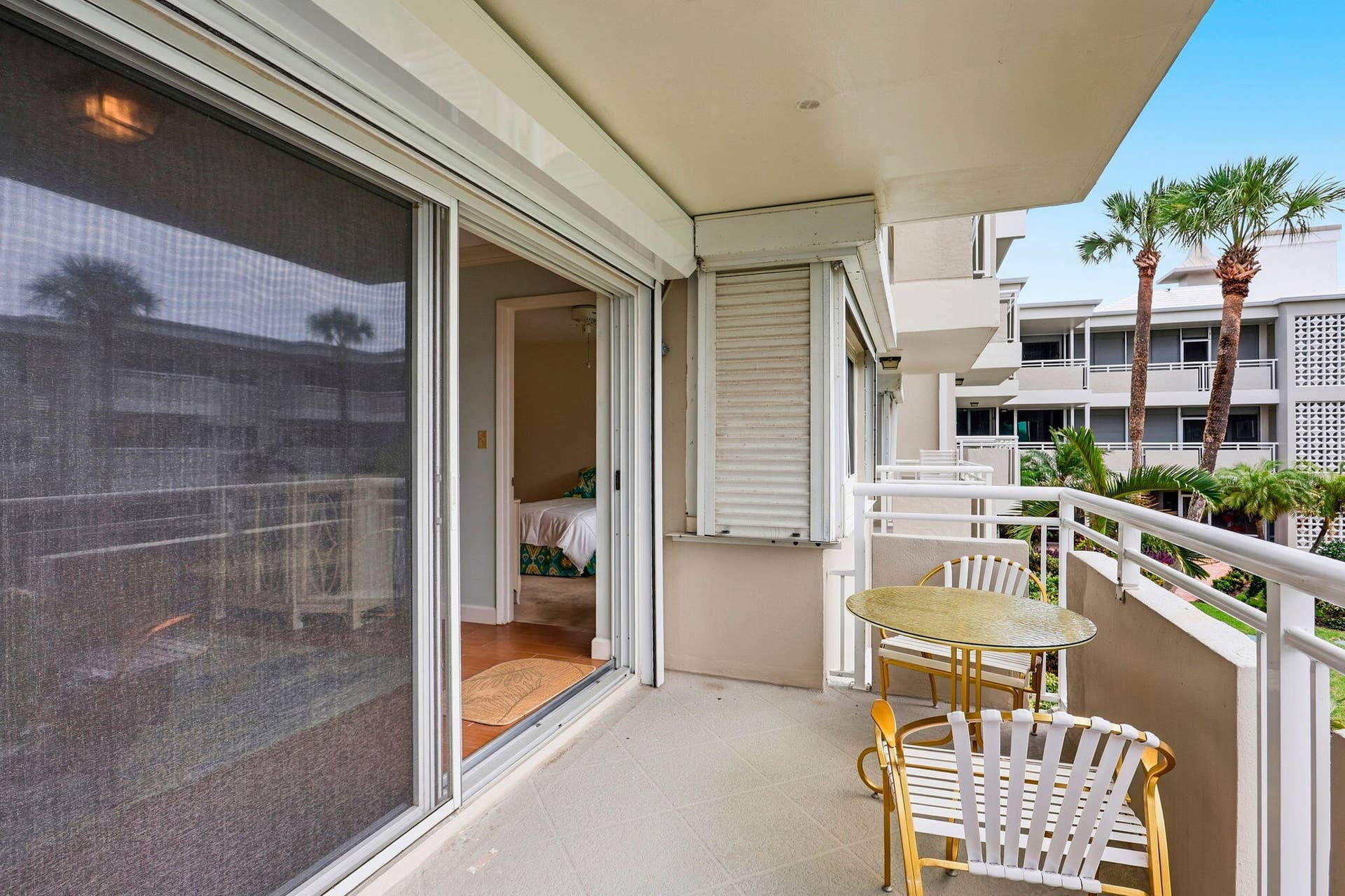 1198 Hillsboro Mile, #210, Hillsboro Beach, FL 33062 Balcony with a concrete surface, white railings, and a sliding glass door
