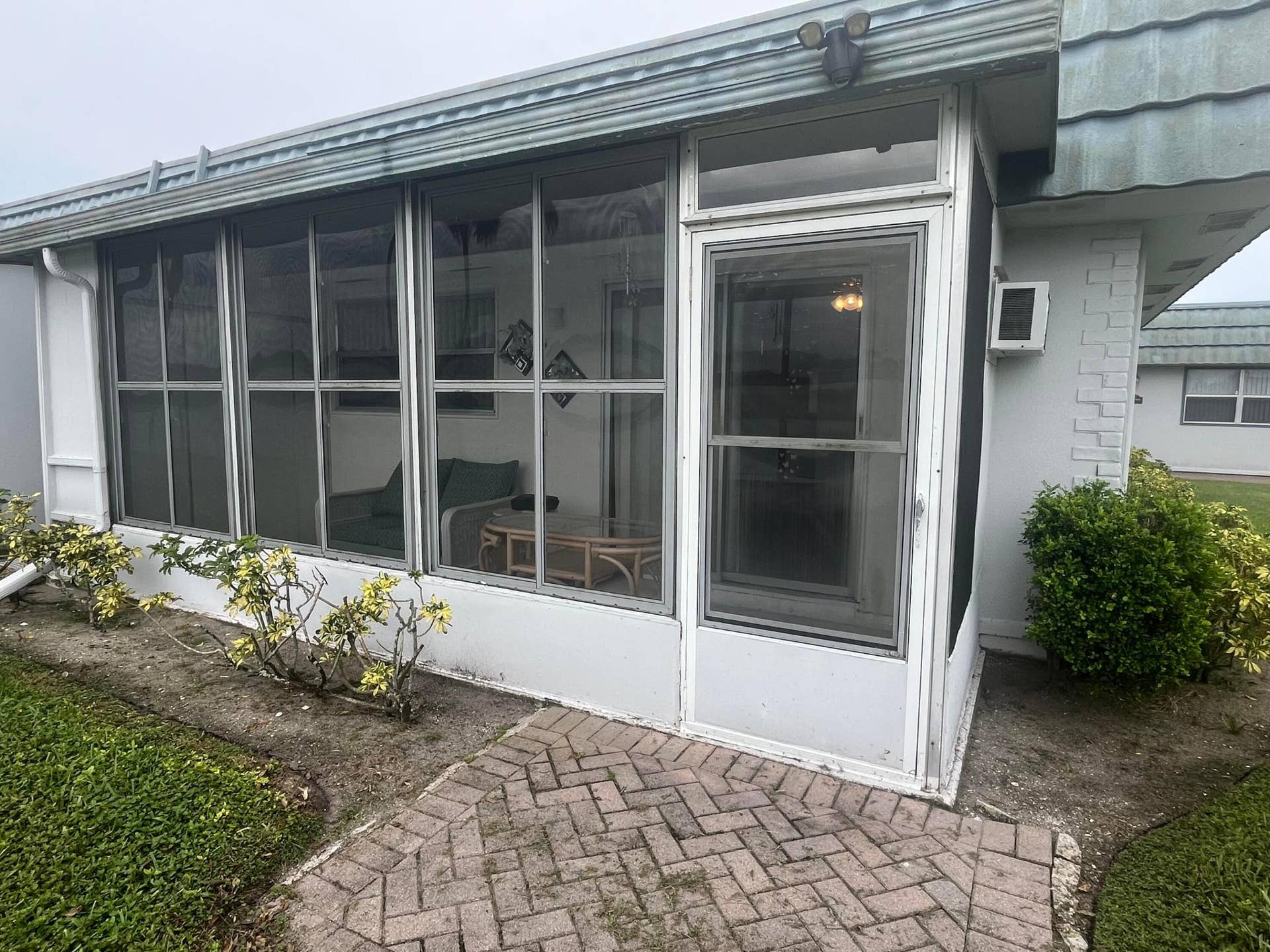 from rear outside enclosed patio
