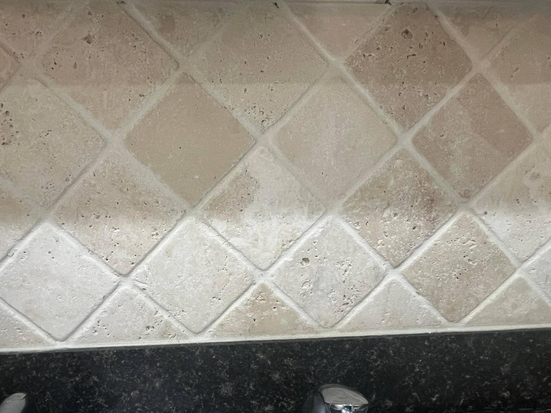 tumble marble backsplash in the kitchen