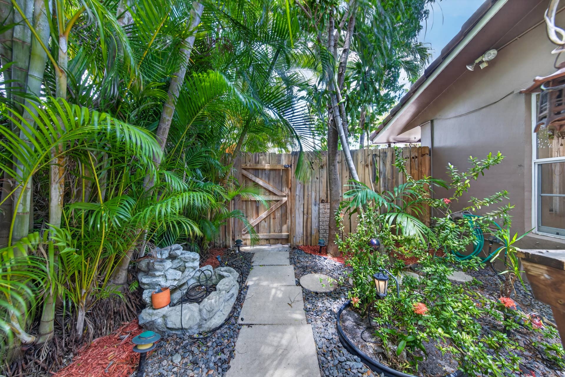 1540 NE 40th Street, Oakland Park, FL 33334 yard - to right of home with gate