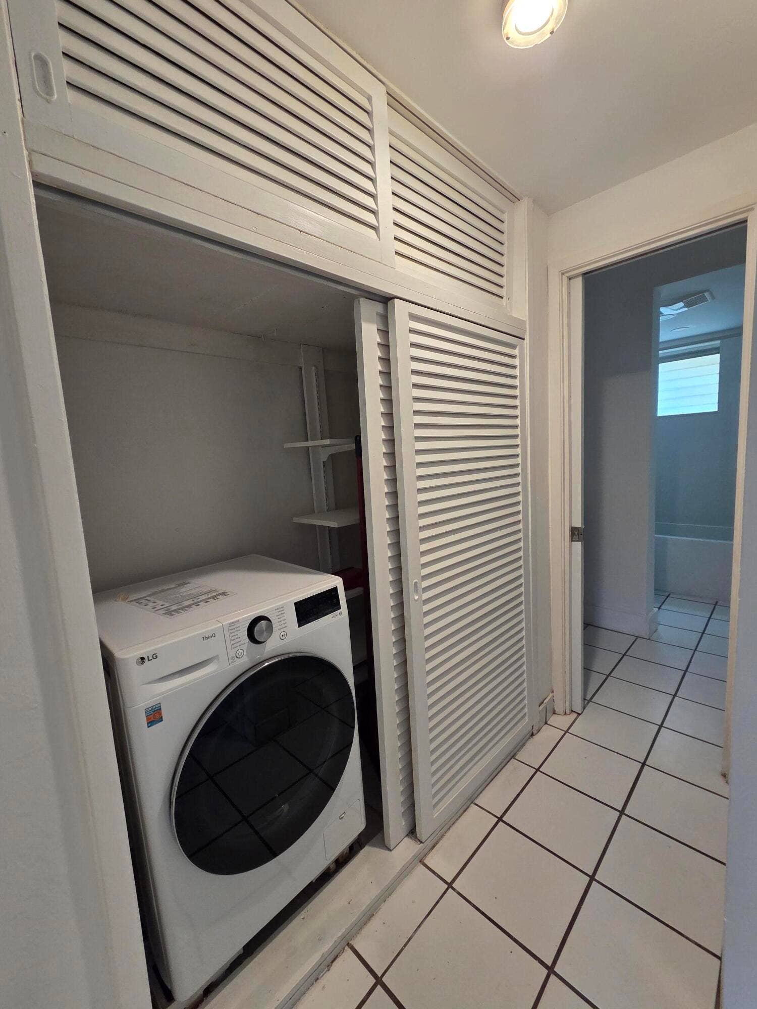 2716 NE 30TH Place, #105C, Fort Lauderdale, FL 33306 Hallway closet with all in one washer/dryer