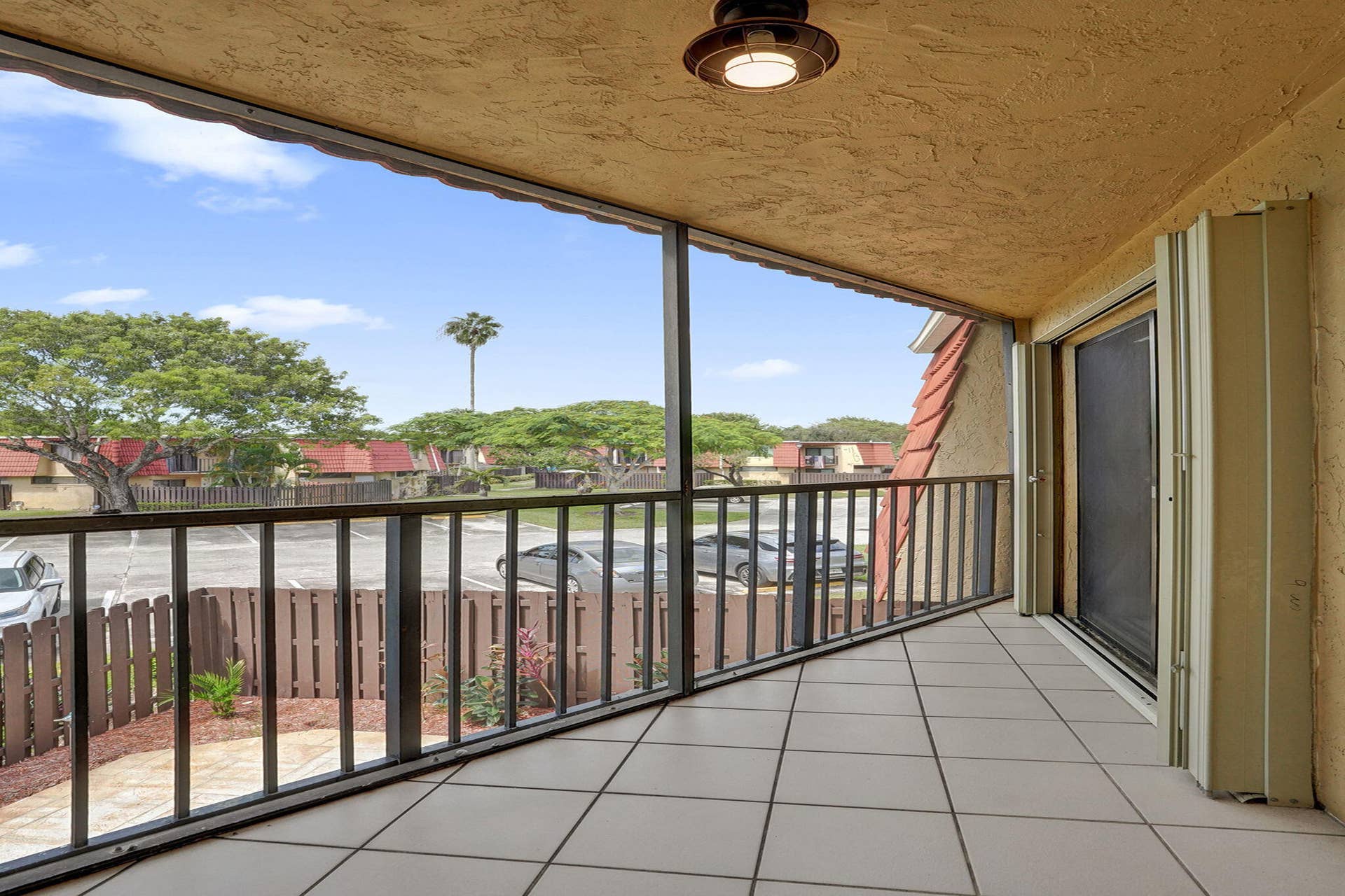 Private screened balcony just off the primary bedroom