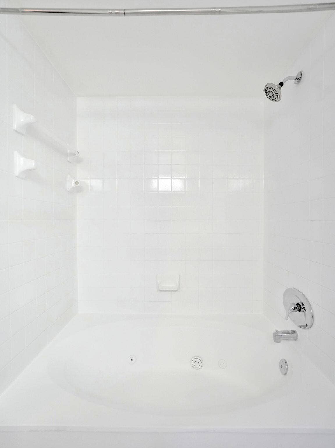 Integrated shower and soaking tub combination