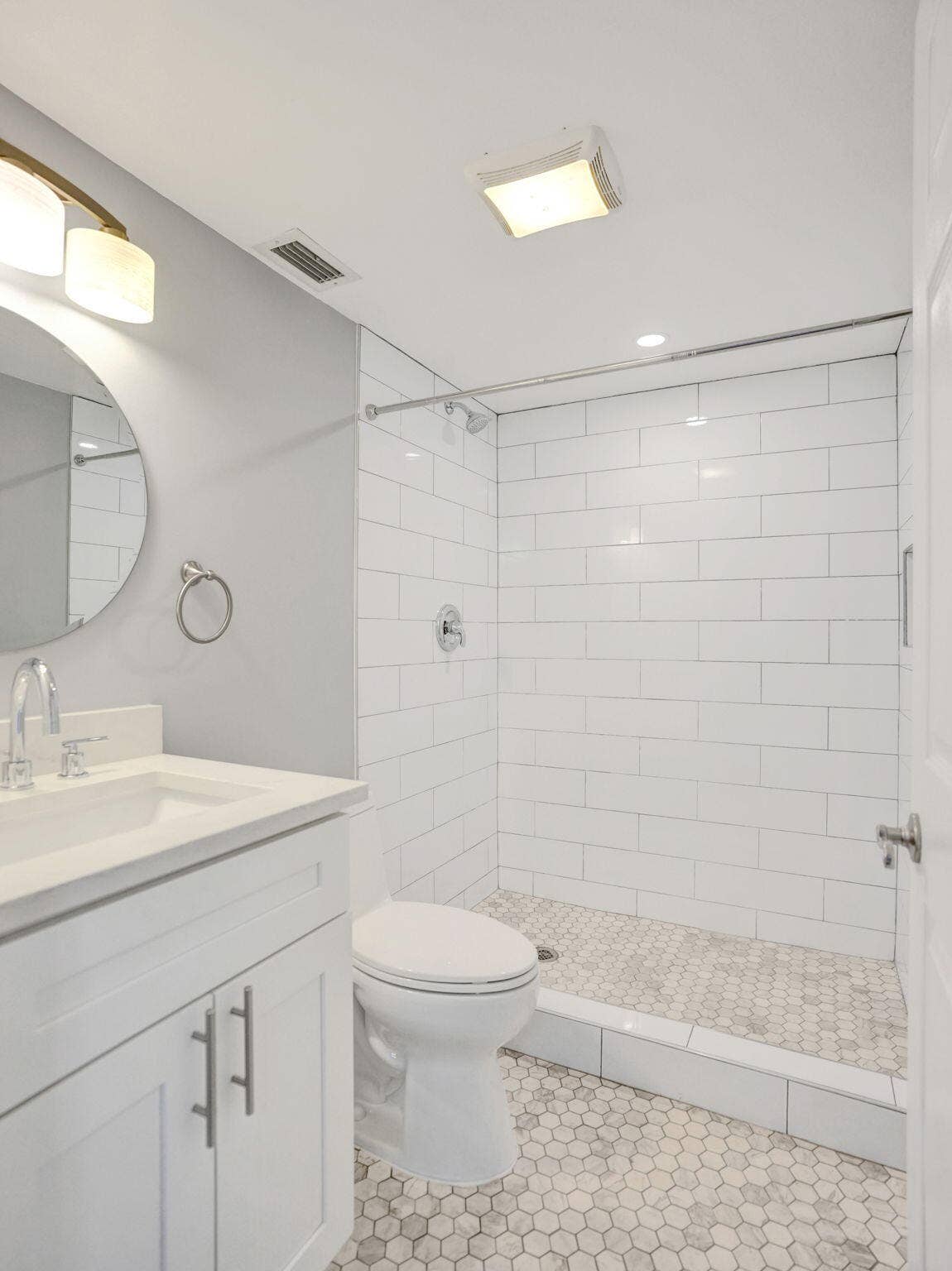 En suite bath with modern updates and standing shower