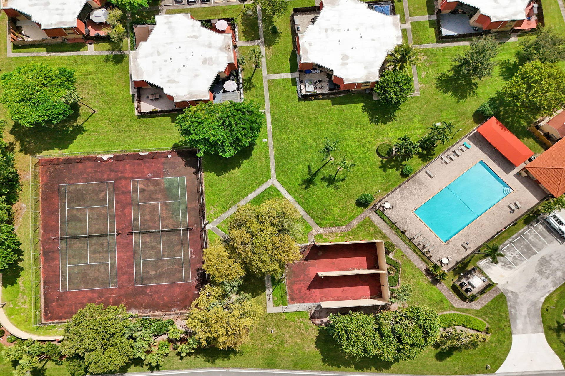 Community features a swimming pool, two tennis courts, and expansive green spaces