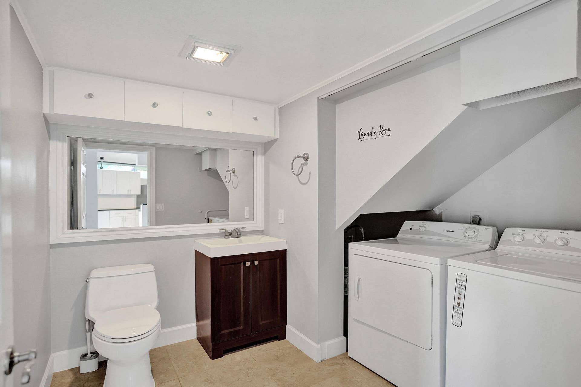 Downstairs half bath with full size washer dryer