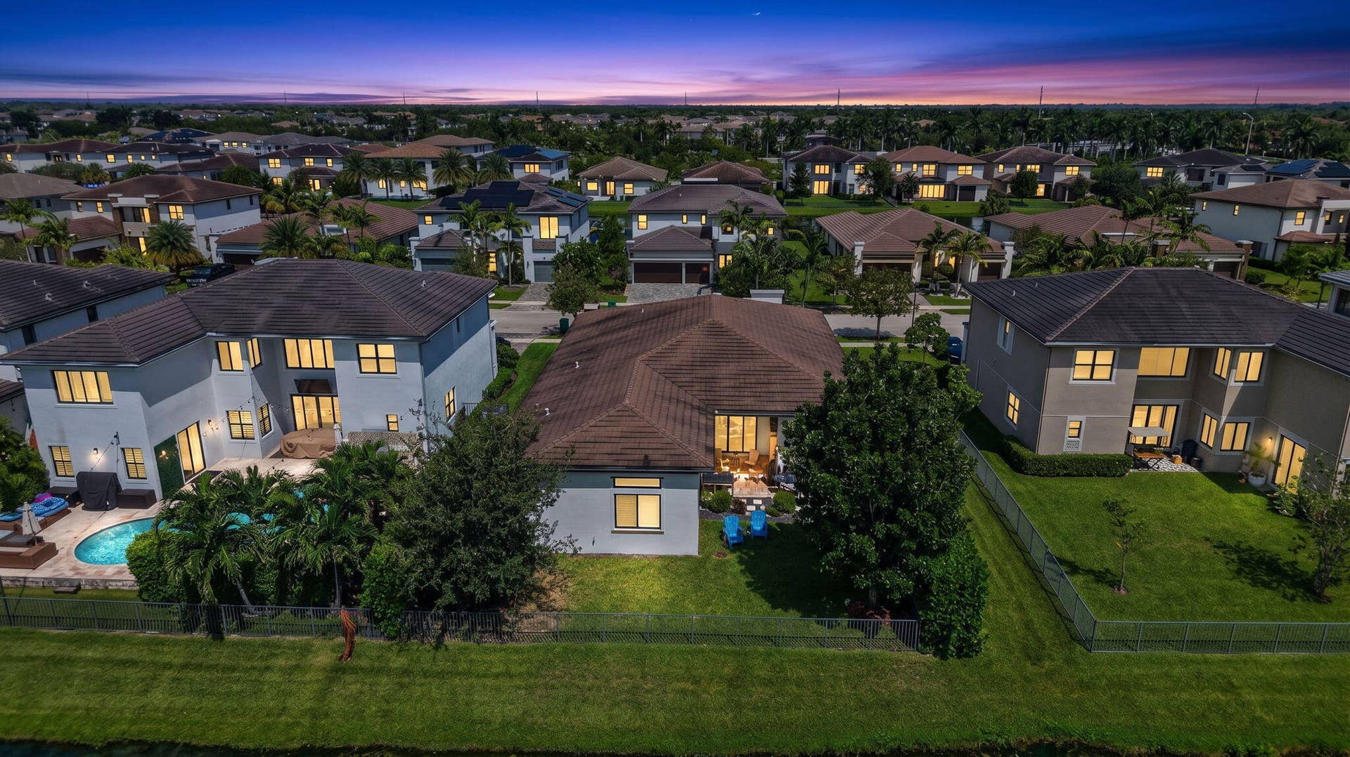 10490 S Lago Vista Circle, Parkland, FL 33076 7-web-or-mls-Aerial Twilight Back top
