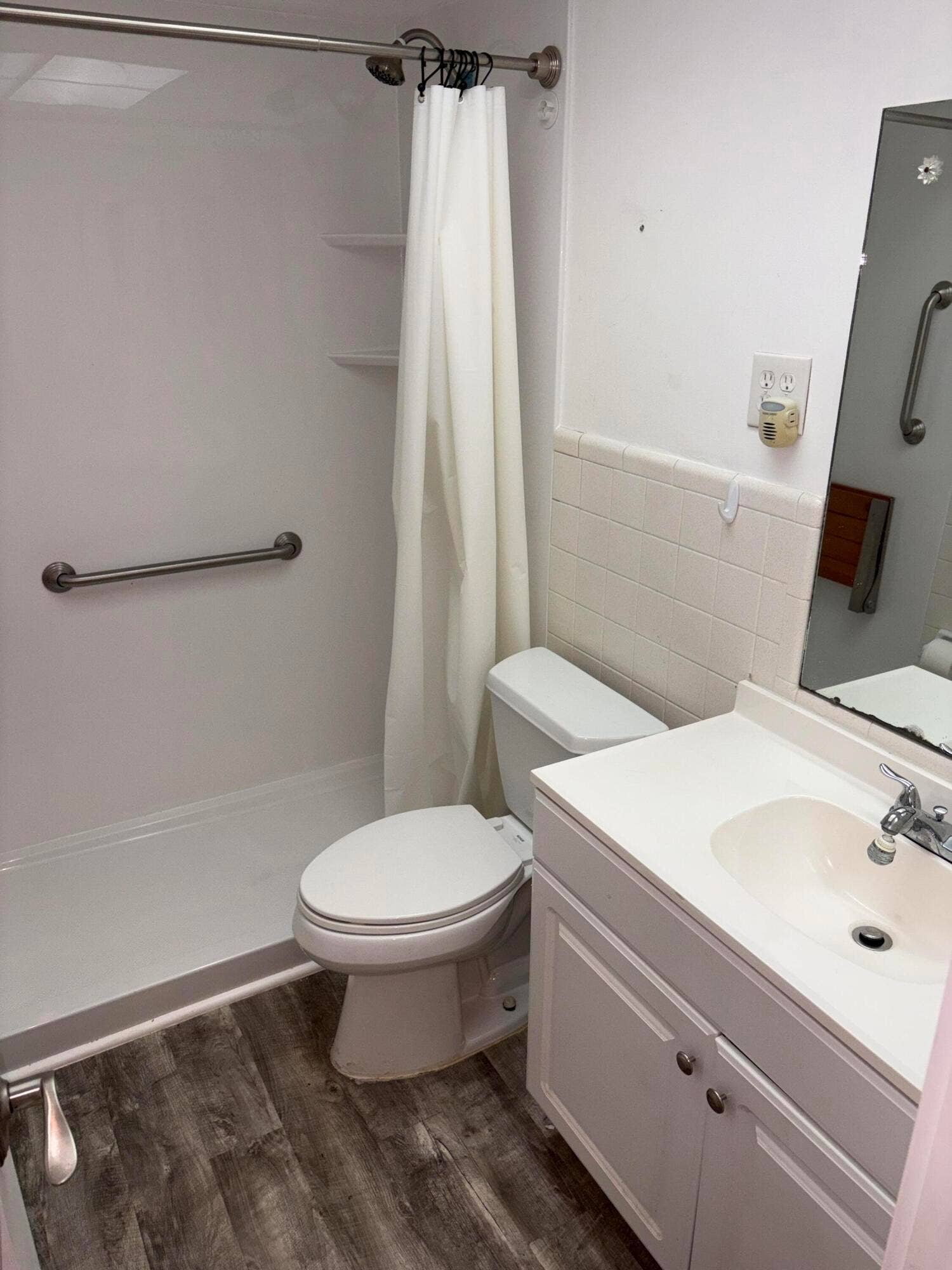 bath with step in Jacuzzi shower fitter