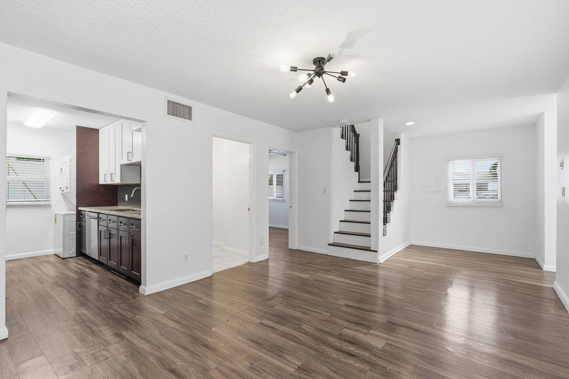 110 NE 16th Terrace, #1-3, Fort Lauderdale, FL 33301 First floor has peel and stick vinyl flooring over ceramic tile. One bedroom and one bath is downstairs with the kitchen and living area.