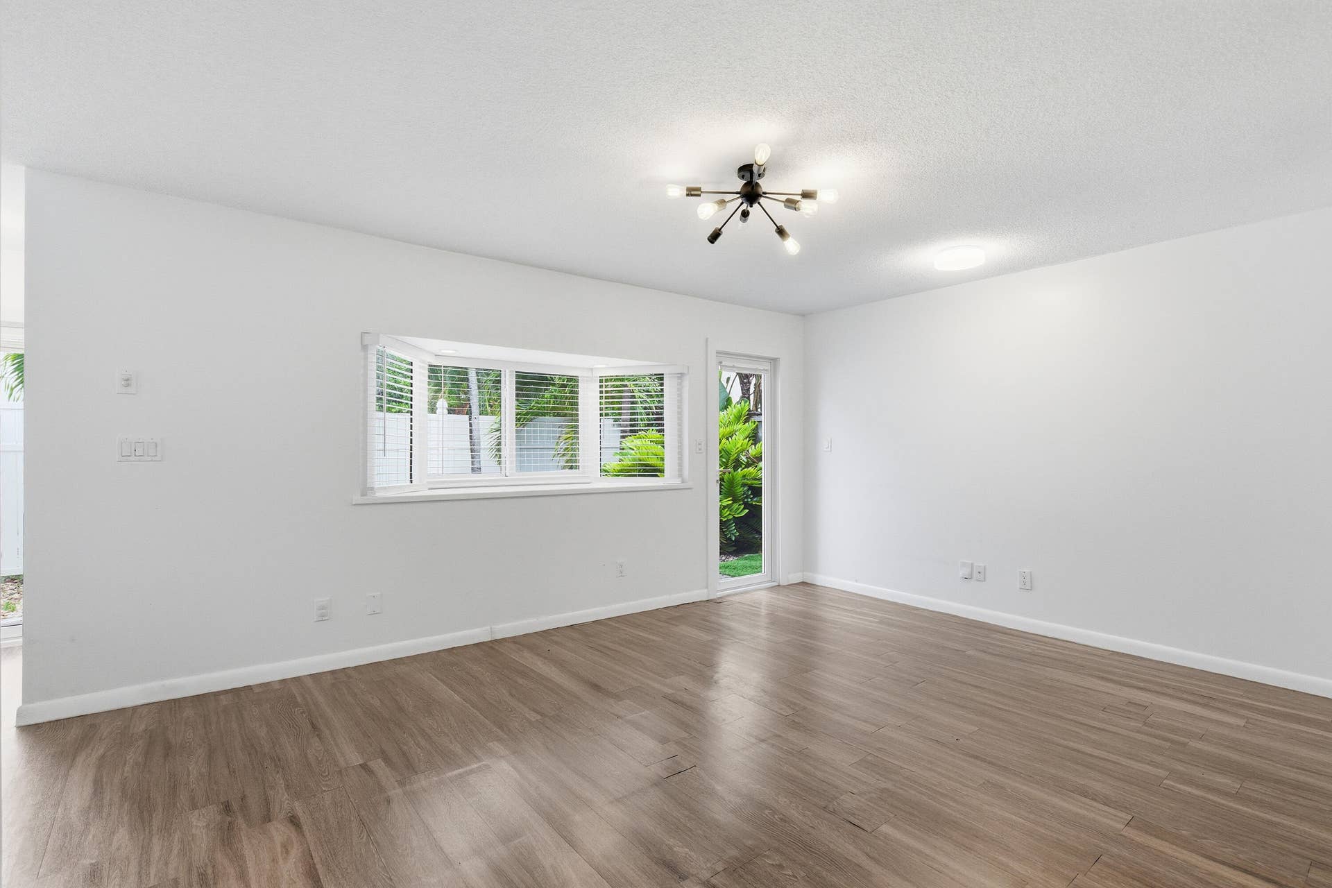 110 NE 16th Terrace, #1-3, Fort Lauderdale, FL 33301 First floor living area with entry door and garden window.