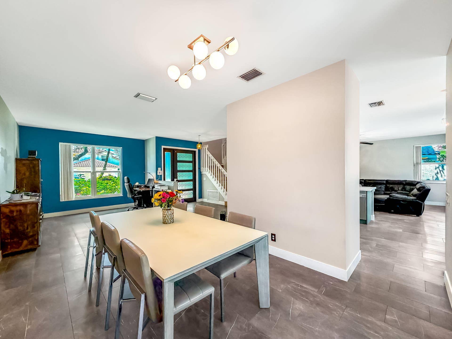 18980 CONCERTO Drive, Boca Raton, FL 33498 Open-concept dining area with large format tile flooring and a multi-bulb ceiling fixture