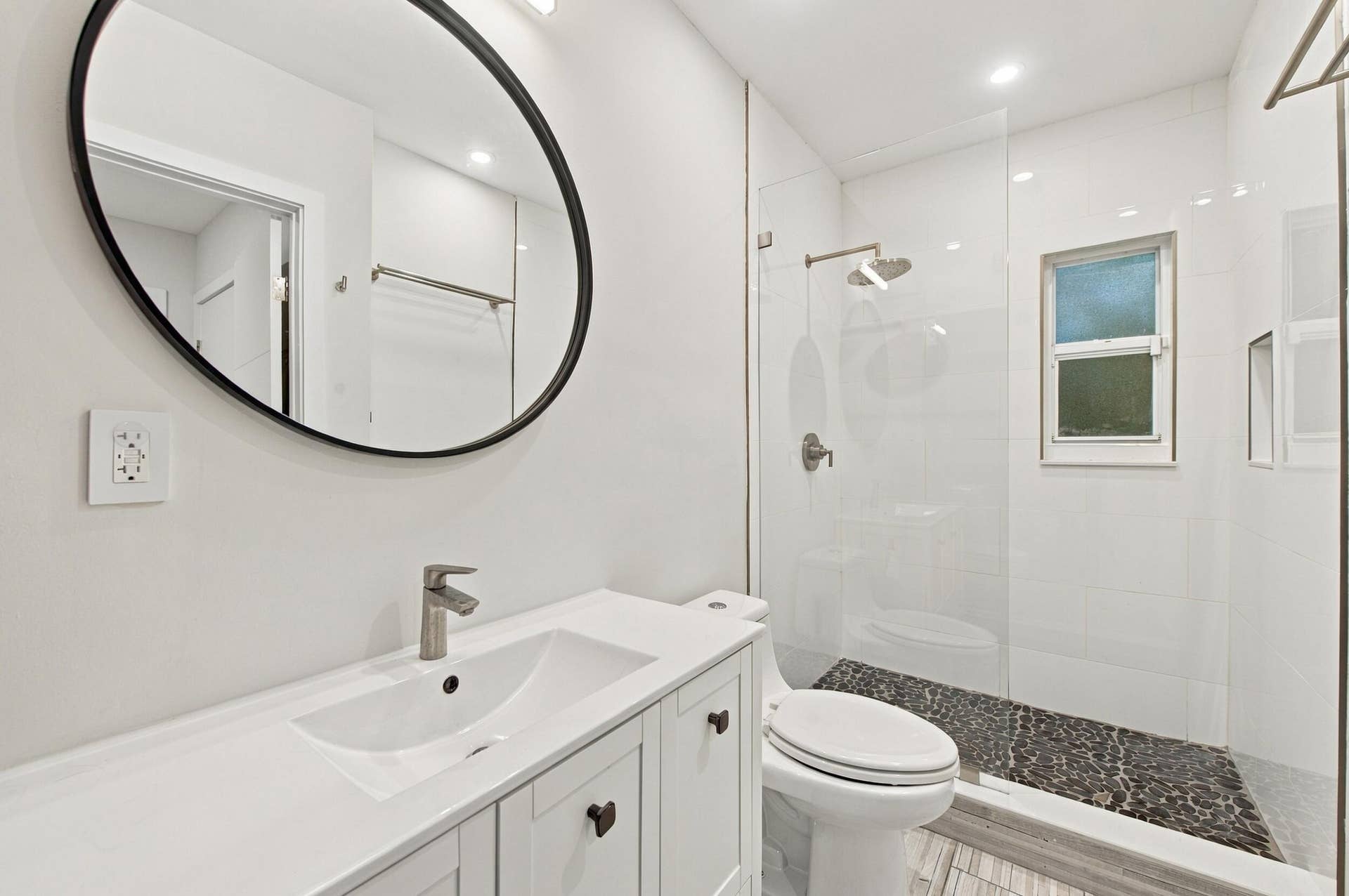Modern vanity with an integrated sink and brushed nickel faucet