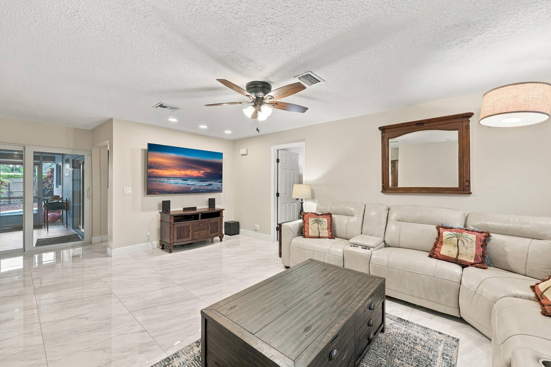 3590 Lakeview Drive, Delray Beach, FL 33445 The family room is a versatile space for children of all ages. Relax and enjoy a separate area away from the kitchen and formal living room that also provides direct access through sliding glass doors to the covered patio and one-of-a-kind backyard.