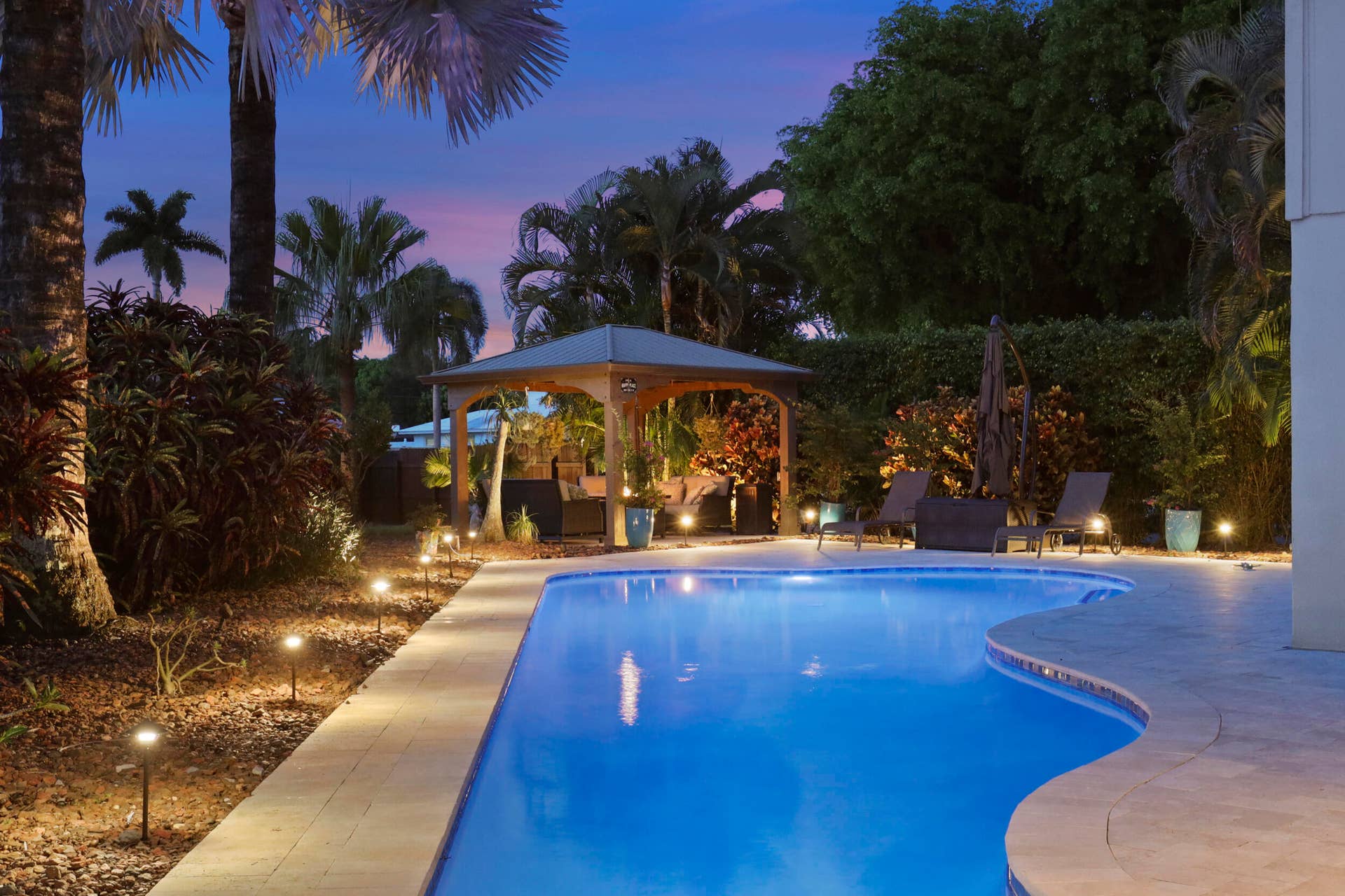 3590 Lakeview Drive, Delray Beach, FL 33445 The resort-style pool starts underneath the roof line and expands down the oversized lot. Swim Olympic laps in your own backyard.
