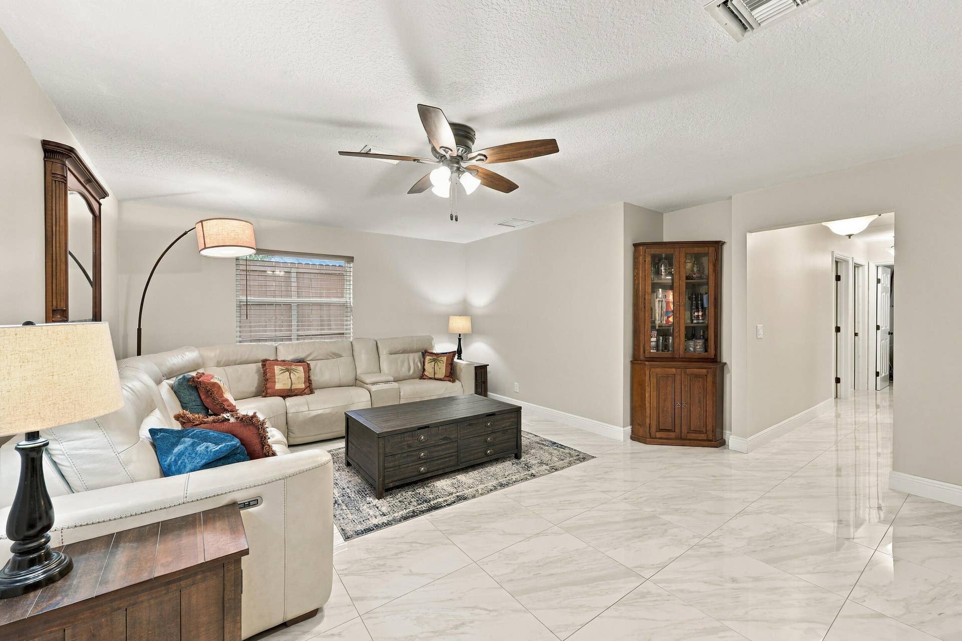 3590 Lakeview Drive, Delray Beach, FL 33445 The family room is a versatile space for children of all ages. Relax and enjoy a separate area away from the kitchen and formal living room that also provides direct access through sliding glass doors to the covered patio and one-of-a-kind backyard. Down the hallway are three guest bedrooms and two full bathrooms.