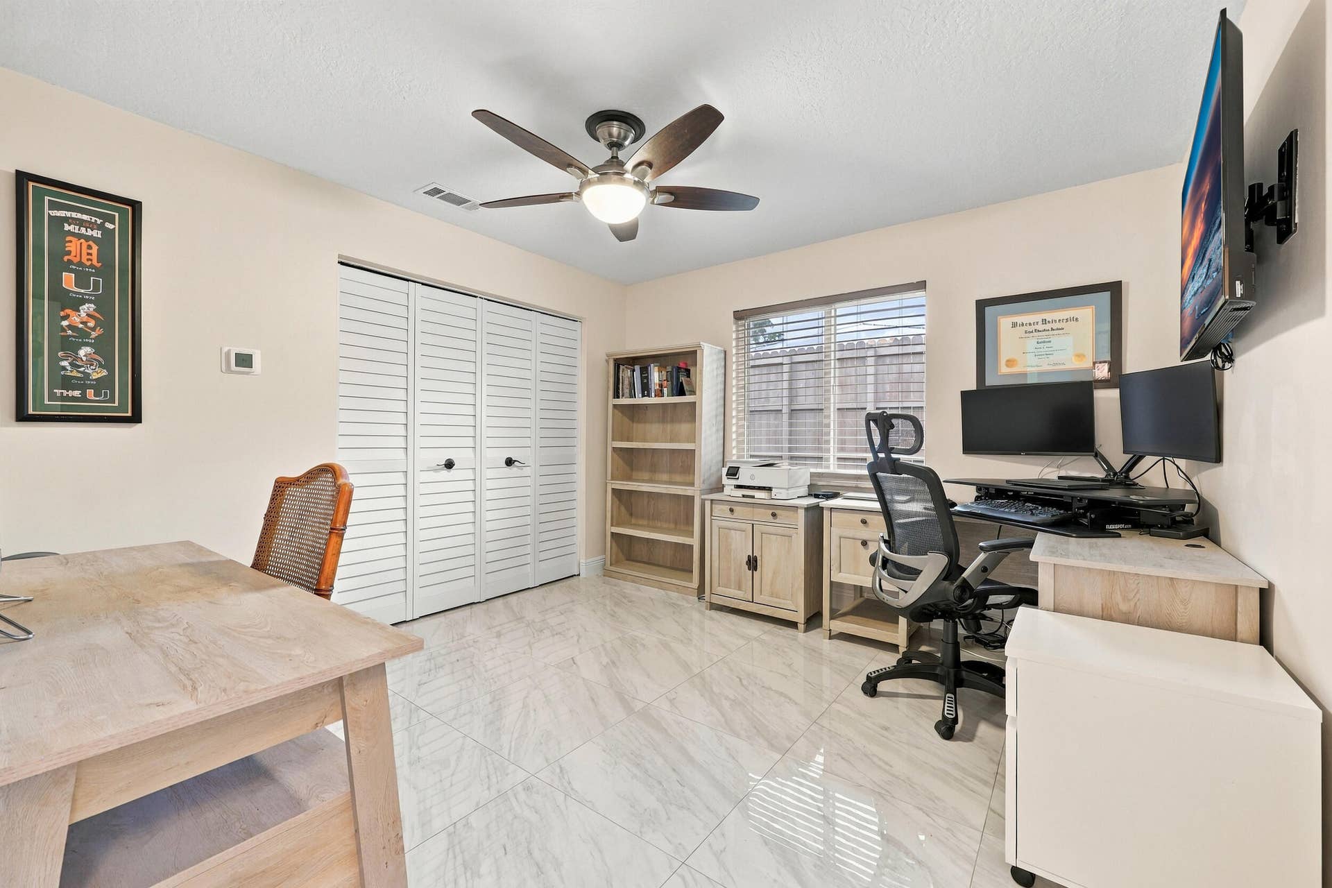 3590 Lakeview Drive, Delray Beach, FL 33445 Guest bedroom 1 is spacious with large impact windows and ample closet space.