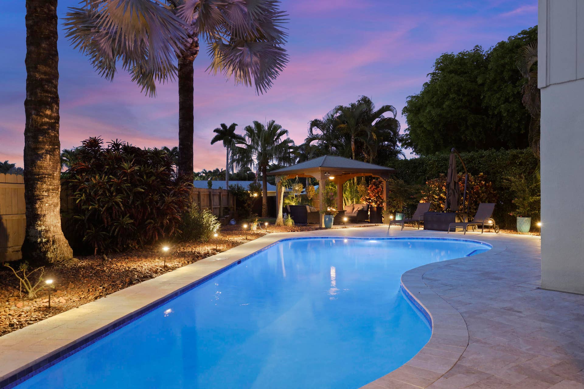 3590 Lakeview Drive, Delray Beach, FL 33445 The resort-style pool starts underneath the roof line and expands down the oversized lot. Swim Olympic laps in your own backyard.