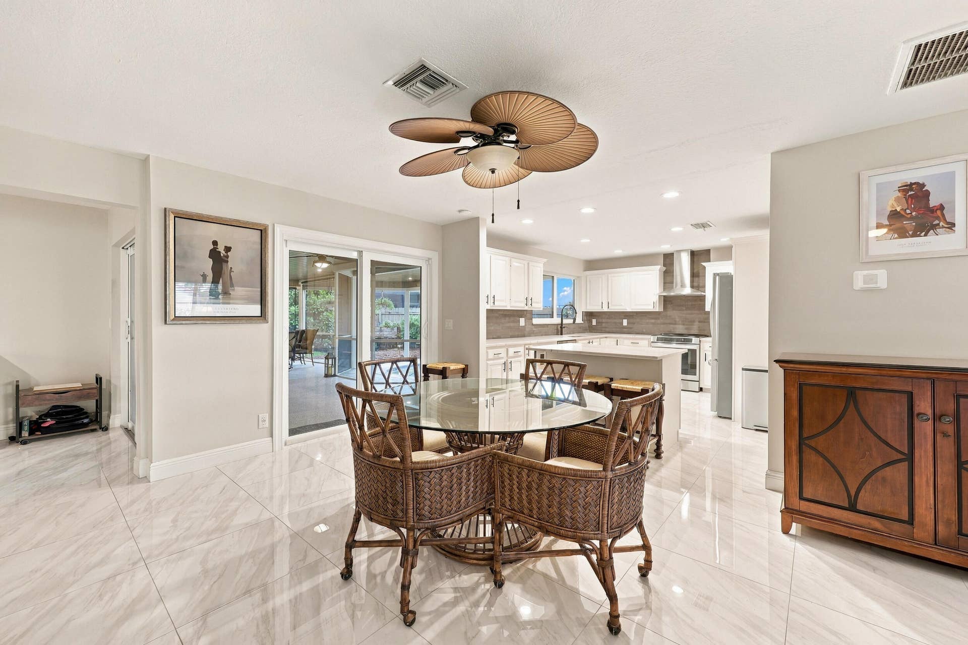 3590 Lakeview Drive, Delray Beach, FL 33445 The dining space and eat-in kitchen are highlighted by new floors and a beautifully updated kitchen with quartz countertops and stainless steel appliances. Views of the resort-style pool can be seen from all areas of the house.