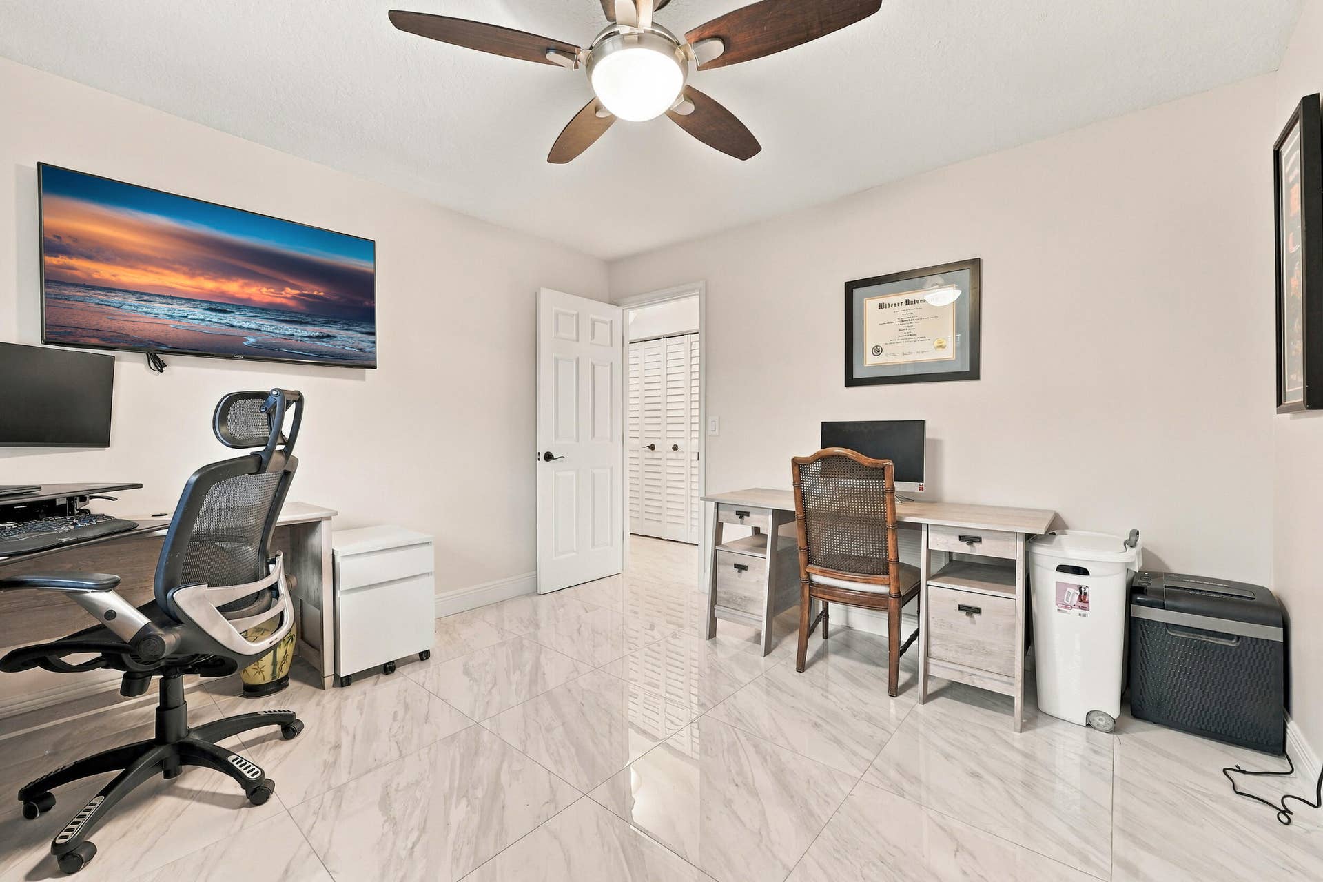 3590 Lakeview Drive, Delray Beach, FL 33445 Guest bedroom 1 is spacious with large impact windows and ample closet space.