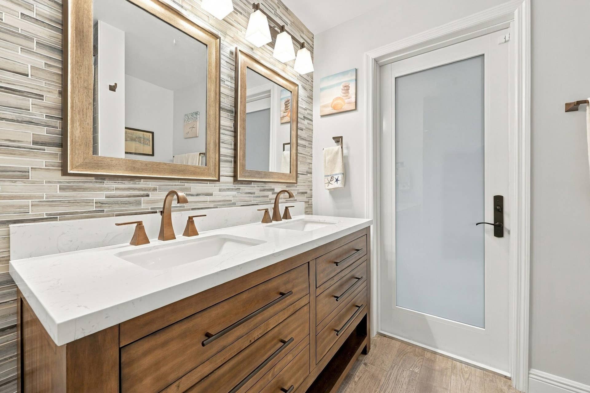 3590 Lakeview Drive, Delray Beach, FL 33445 Bathroom 3 is a fully updated cabana bathroom with a new vanity, countertops, tile, and a tub and shower. Your guests will access it while spending days and evenings in the most beautiful backyard in Delray Beach.