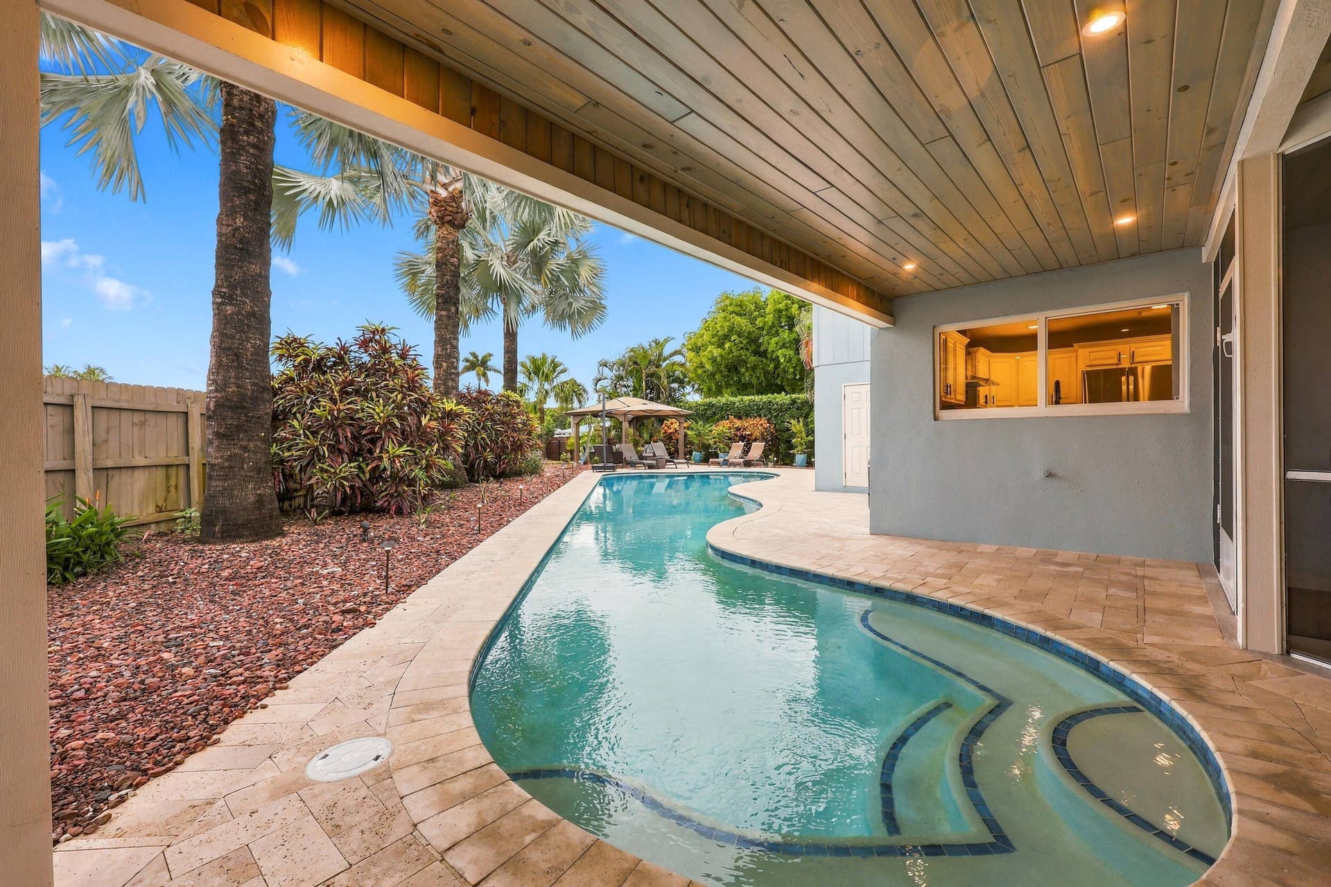 3590 Lakeview Drive, Delray Beach, FL 33445 The resort-style pool starts underneath the roof line and expands down the oversized lot. Swim Olympic laps in your own backyard.