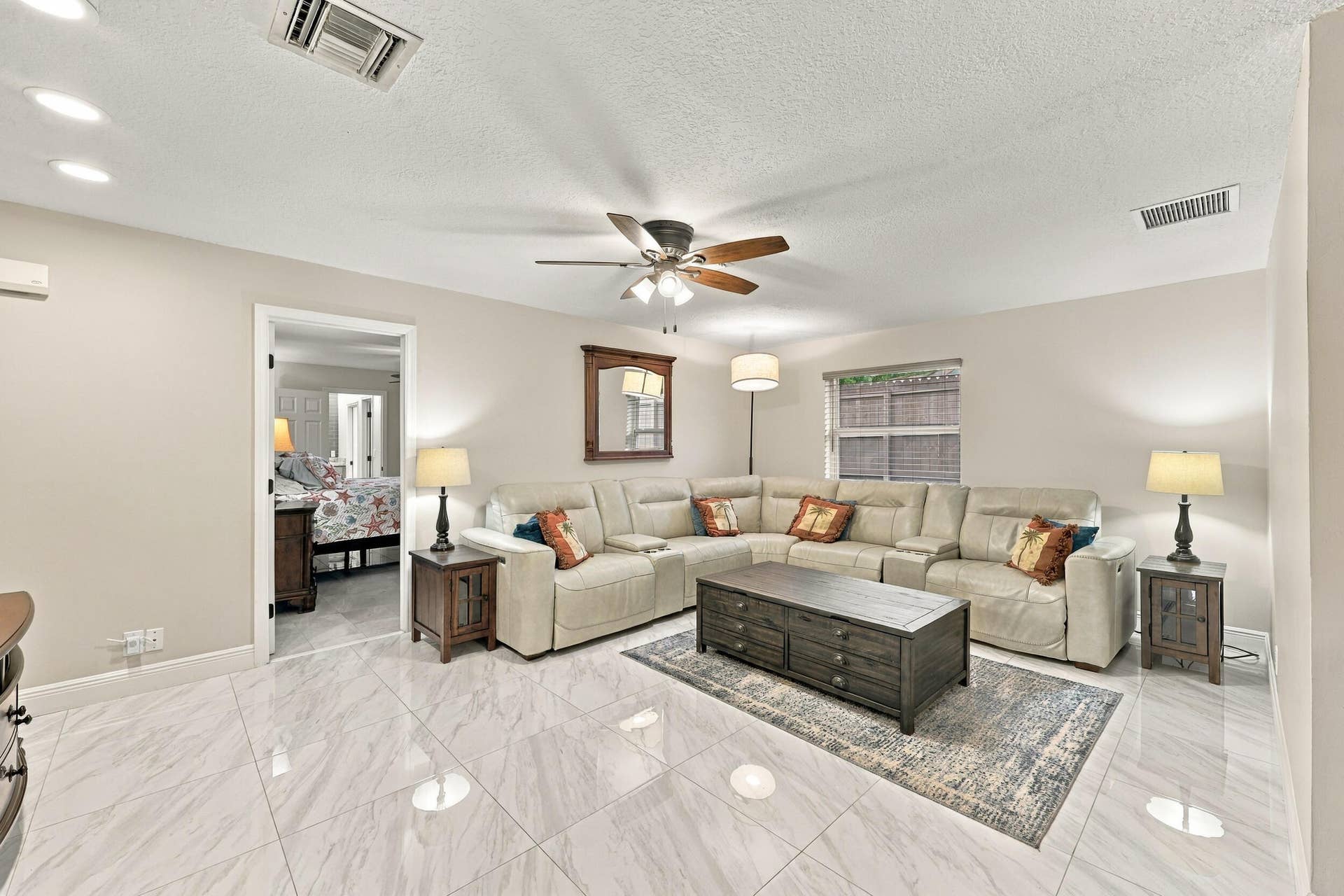 3590 Lakeview Drive, Delray Beach, FL 33445 The family room is a versatile space for children of all ages. Relax and enjoy a separate area away from the kitchen and formal living room that also provides direct access through sliding glass doors to the covered patio and one-of-a-kind backyard.