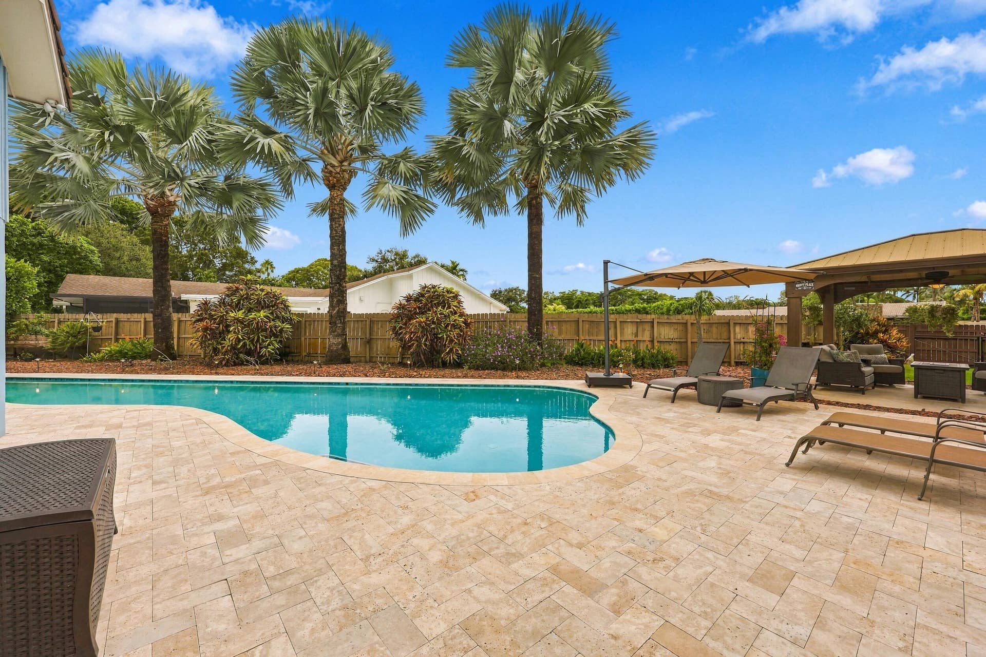 3590 Lakeview Drive, Delray Beach, FL 33445 The resort-style pool starts underneath the roof line and expands down the oversized lot. Swim Olympic laps in your own backyard.