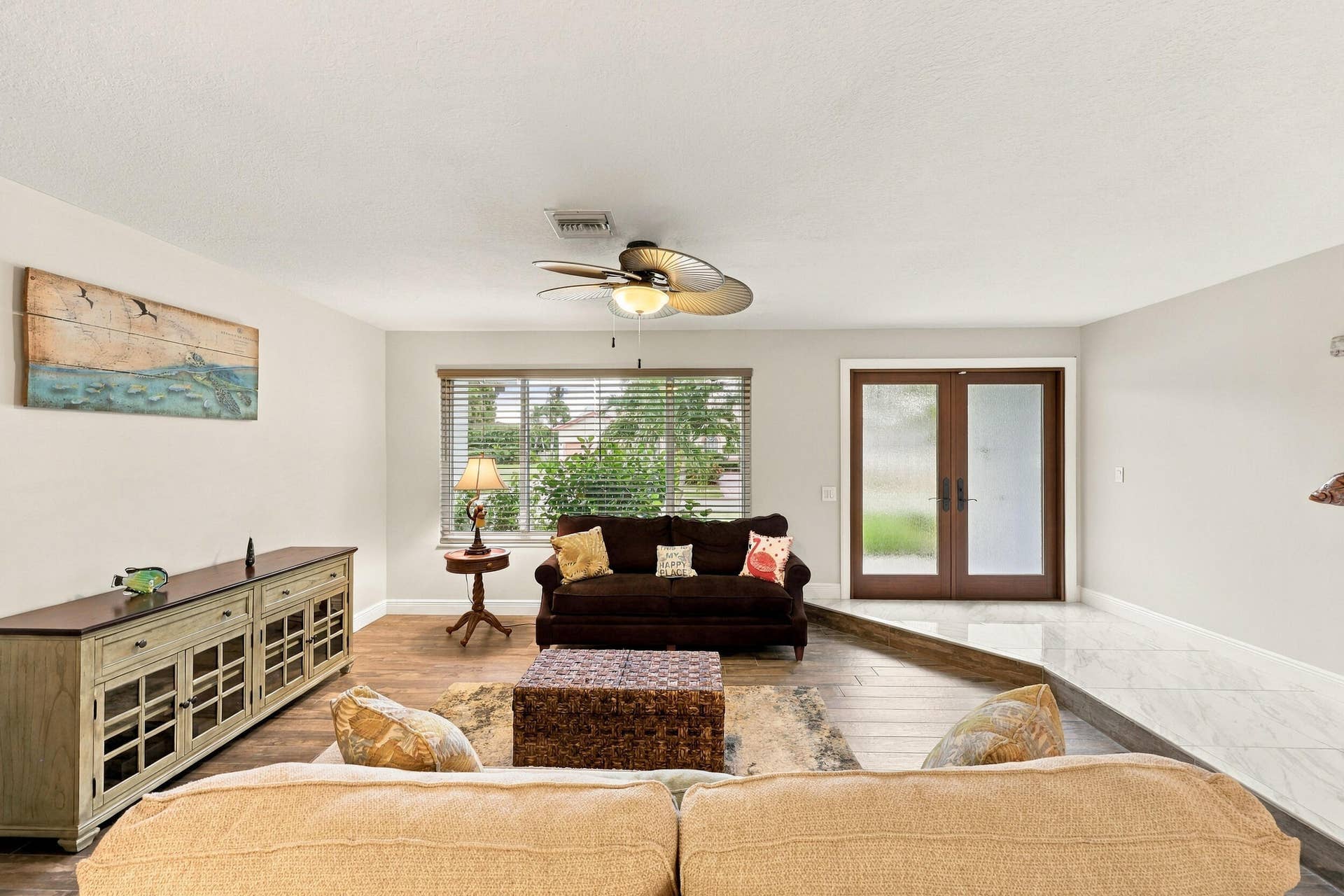 3590 Lakeview Drive, Delray Beach, FL 33445 The formal living room provides abundant natural light through the hurricane impact windows and front door.