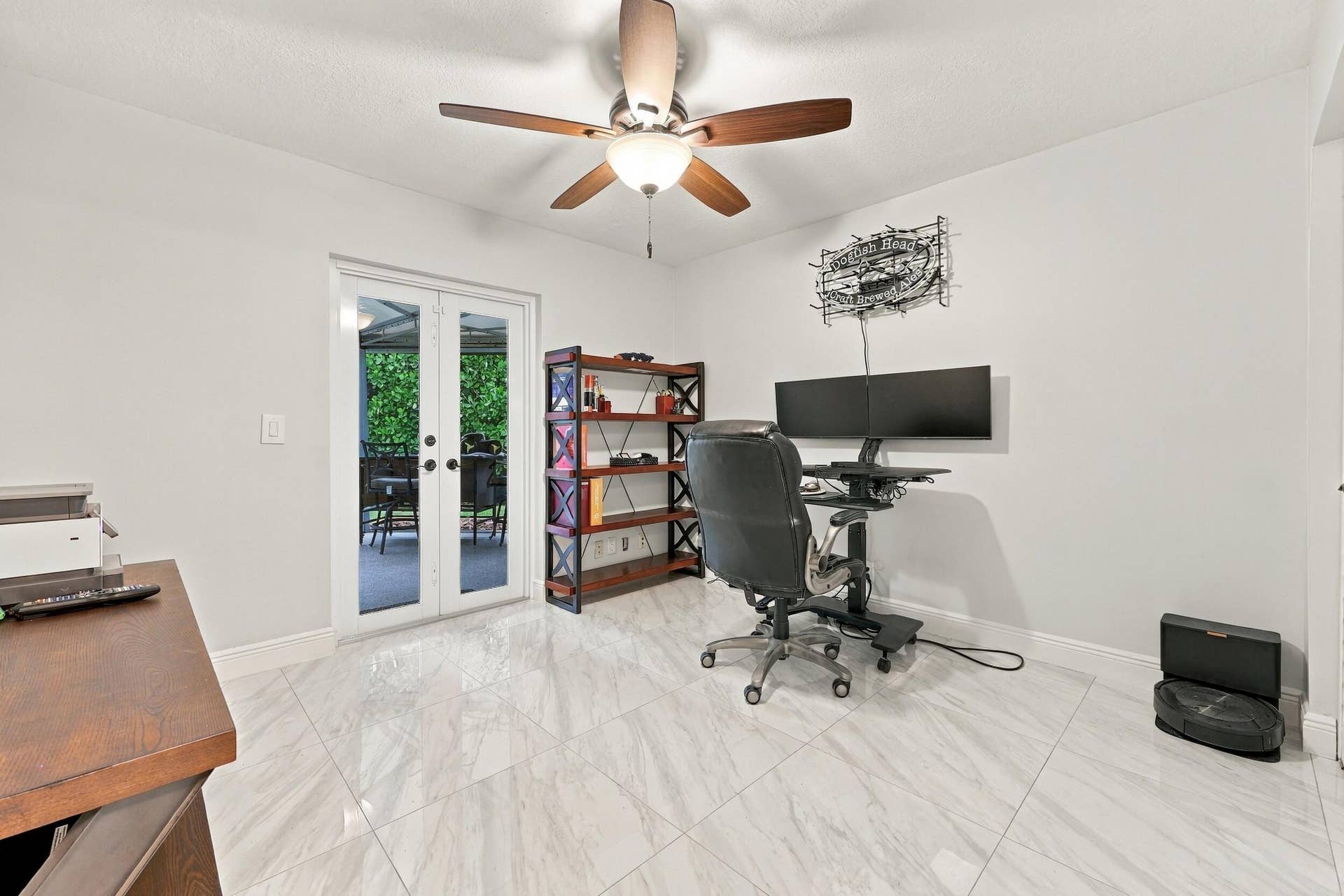 3590 Lakeview Drive, Delray Beach, FL 33445 Guest bedroom 2 is spacious, with an abundance of natural light coming through the hurricane-impact French doors that lead to the 900-square-foot covered and screened-in patio.