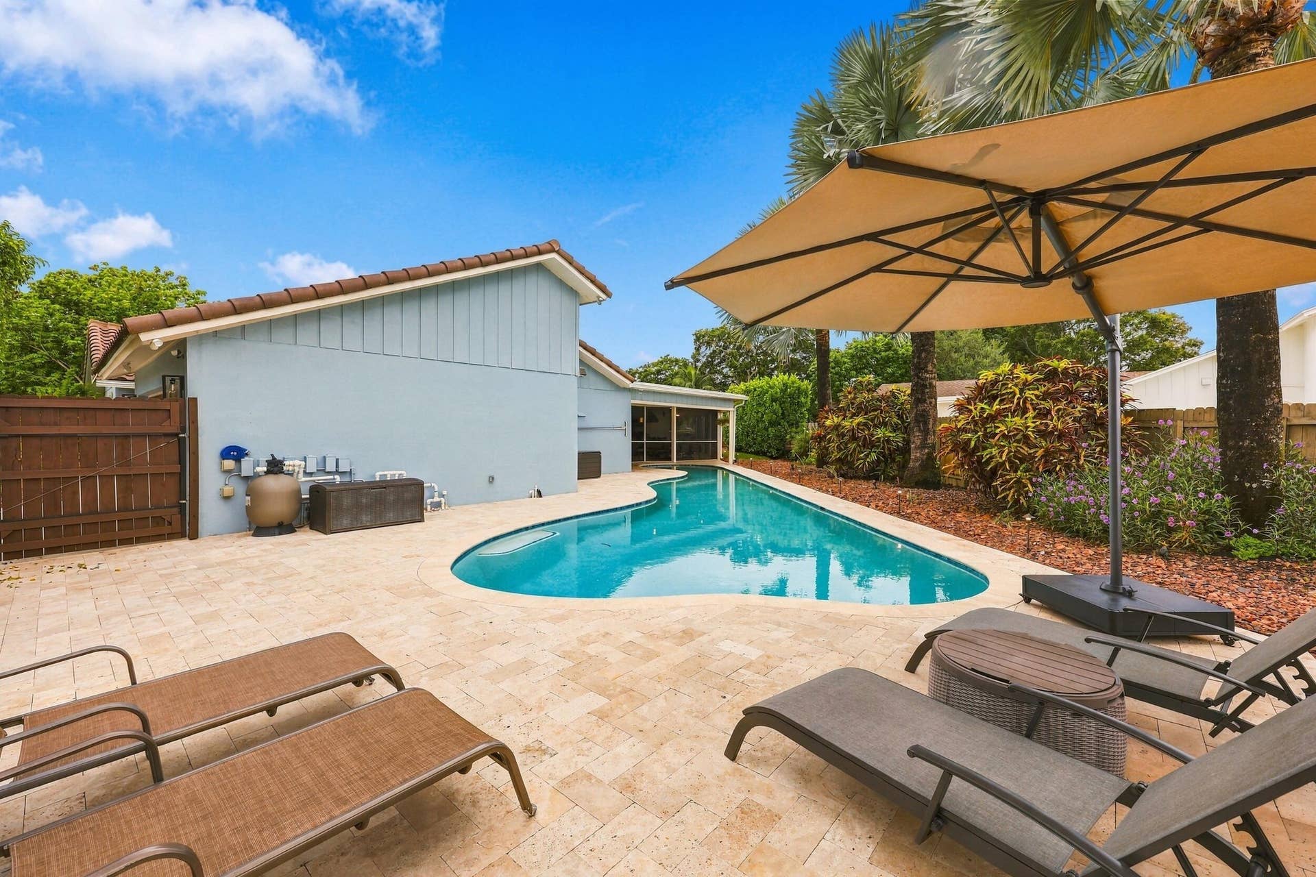 3590 Lakeview Drive, Delray Beach, FL 33445 The resort-style pool starts underneath the roof line and expands down the oversized lot. Swim Olympic laps in your own backyard.