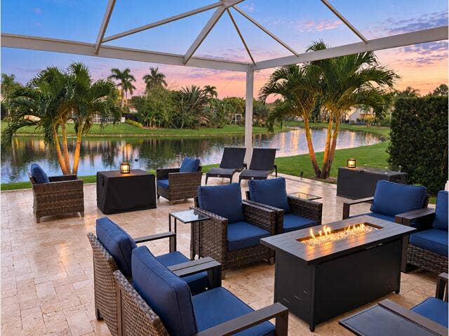 10659 SAINT THOMAS Drive, Boca Raton, FL 33498 screened patio a dusk
