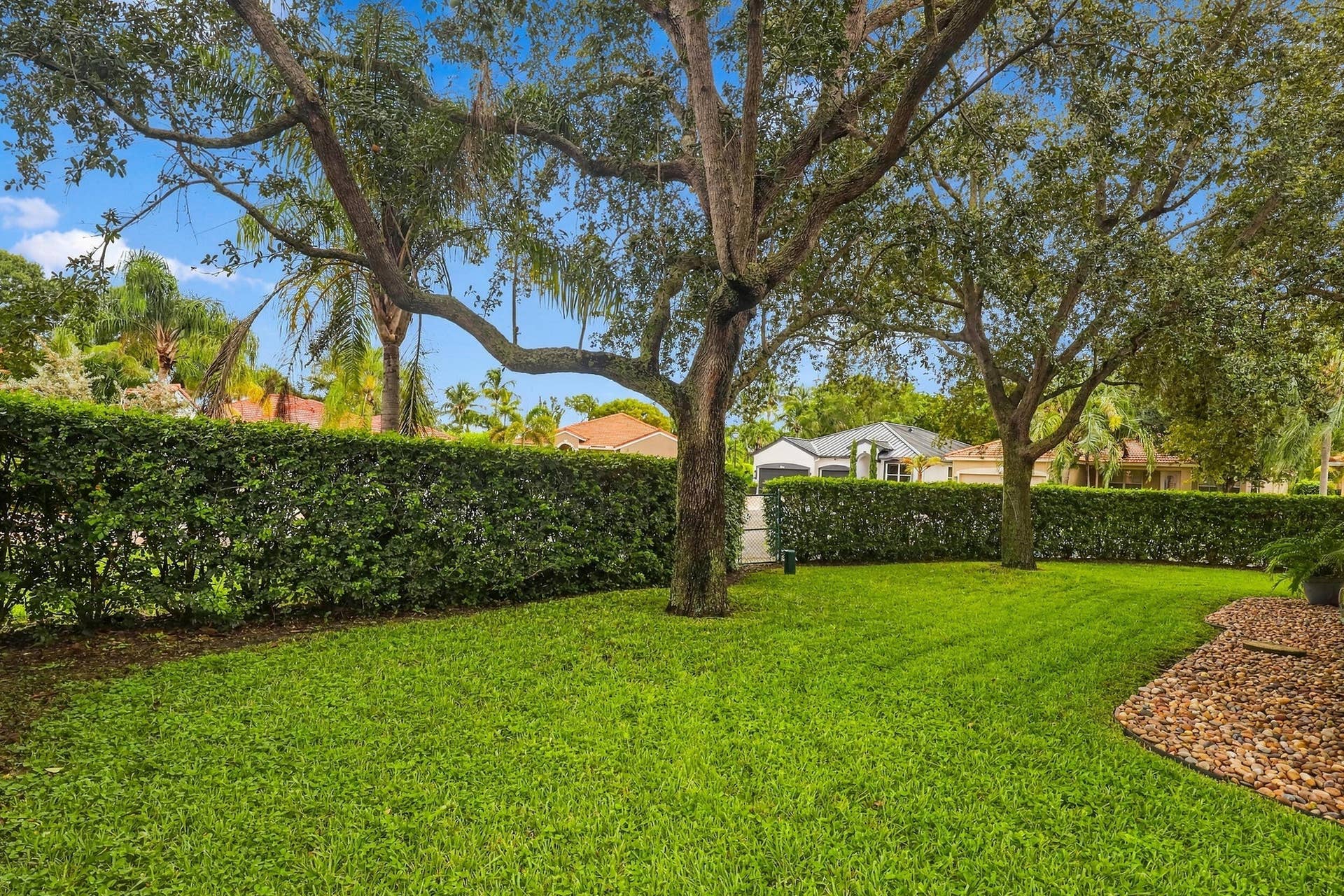 1434 Artimino Lane, Boynton Beach, FL 33436 A 360 square foot covered and screened patio dramatically expands the home's entertaining space, with plenty of room to create both an outdoor living room and dining area for year round enjoyment. Whether hosting family and friends, dining outside, or simply unwinding at the end of the day, the combination of the expansive screened patio, lush hedges, full fencing, and complete rear privacy makes this a truly special outdoor setting.