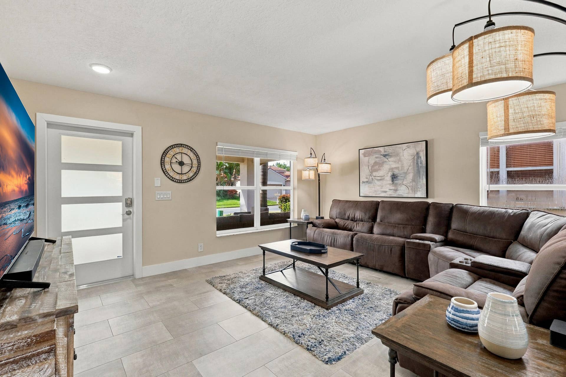 1434 Artimino Lane, Boynton Beach, FL 33436 The formal living room is filled with an abundance of light, new window treatments, and is highlighted by the brand-new porcelain tile floors.